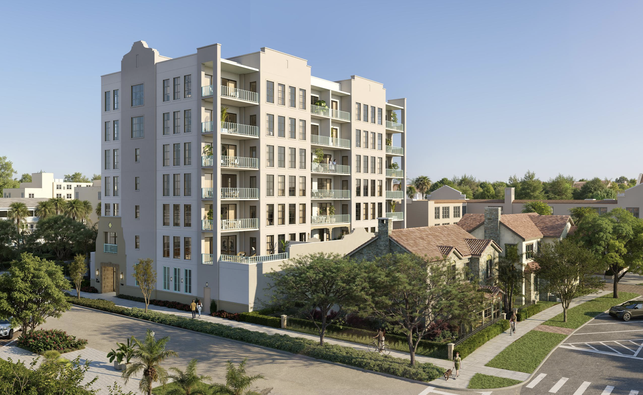 Seven-story modern apartment building with beige exterior, many balconies and large windows, set in a sunny, tree-lined urban neighborhood with pedestrians and a crosswalk.