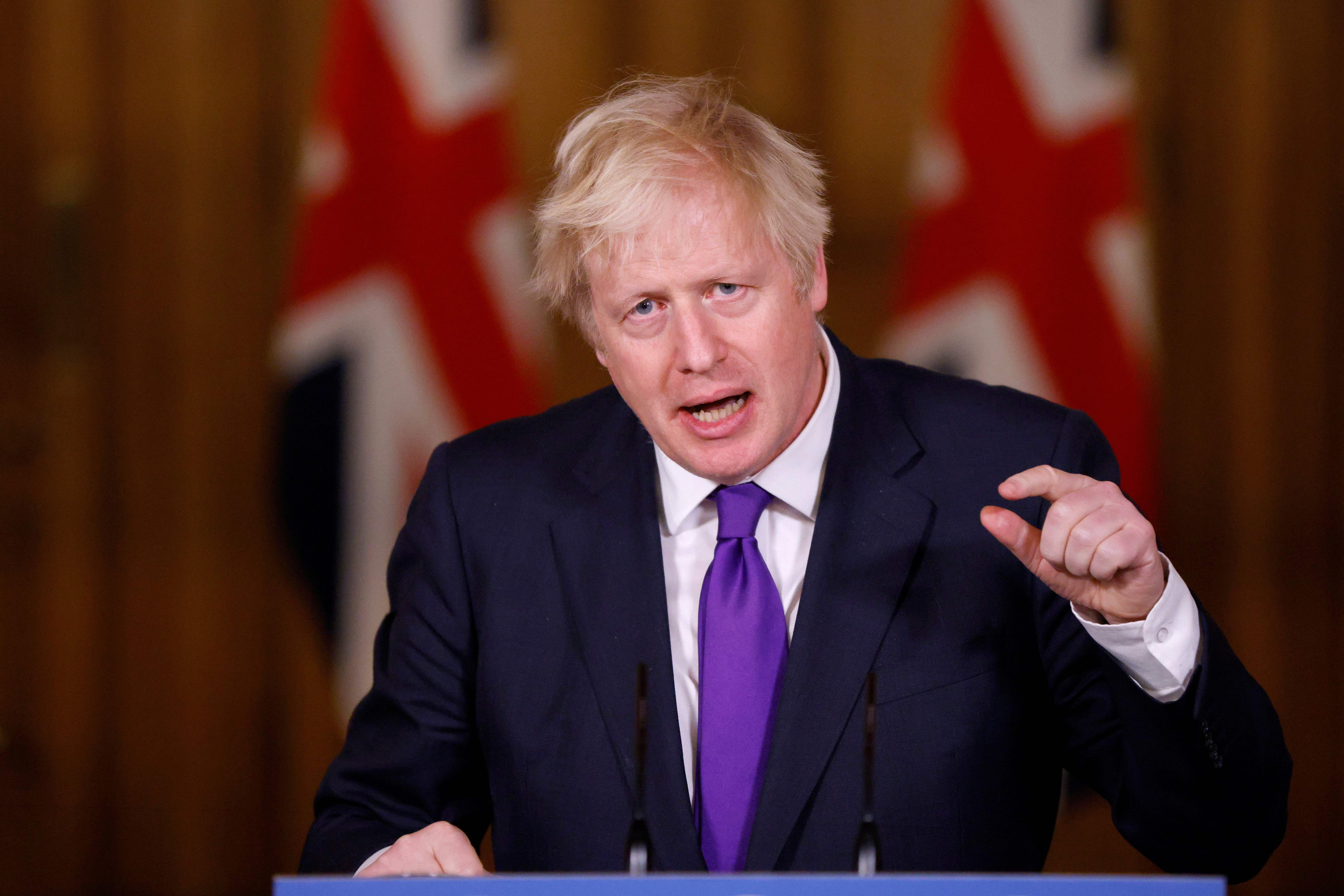 Britain's Prime Minister Boris Johnson speaks during a virtual press conference inside 10 Downing Street in central London on December 2