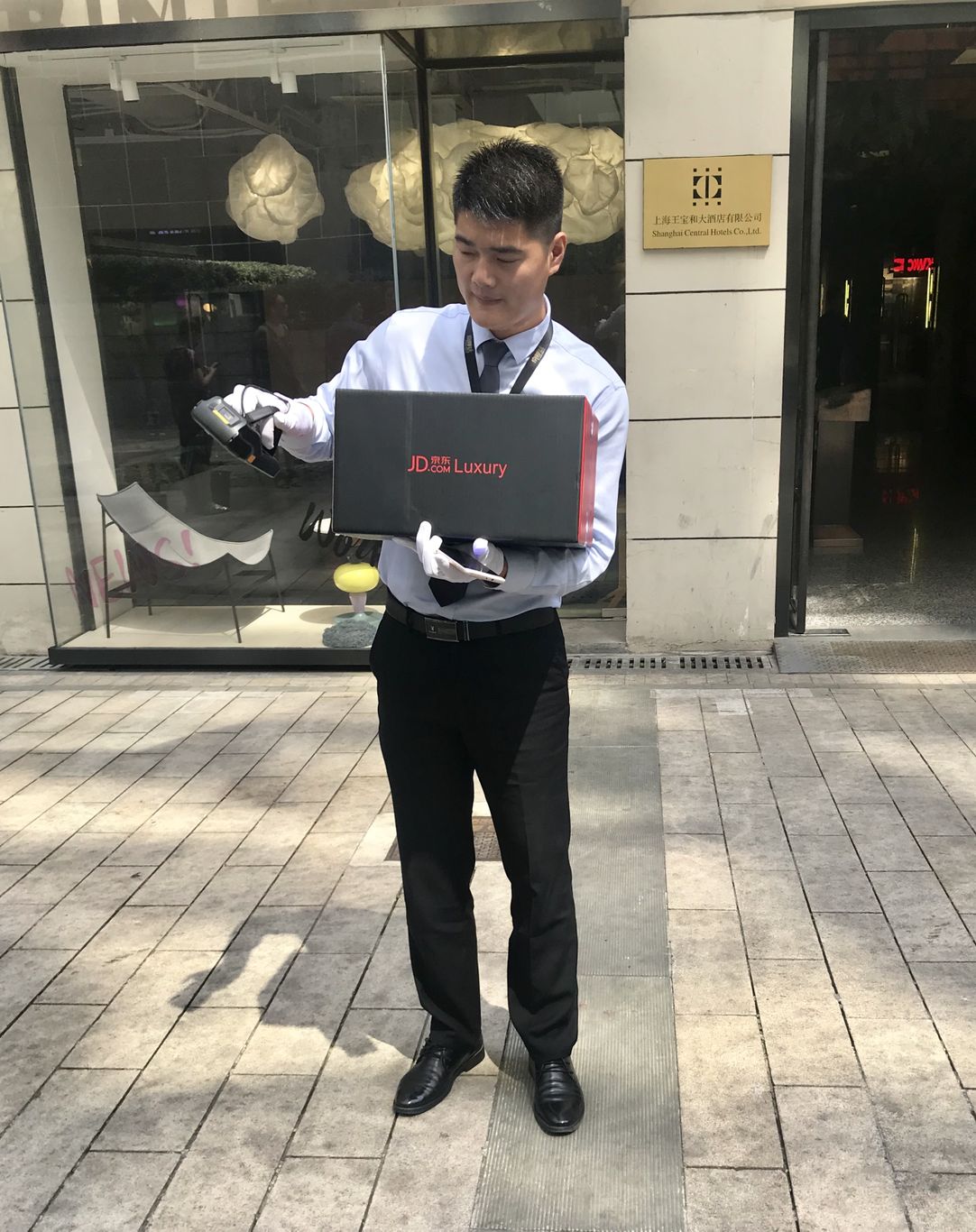 A driver for JD.com Inc.'s Luxury Express delivery service opens