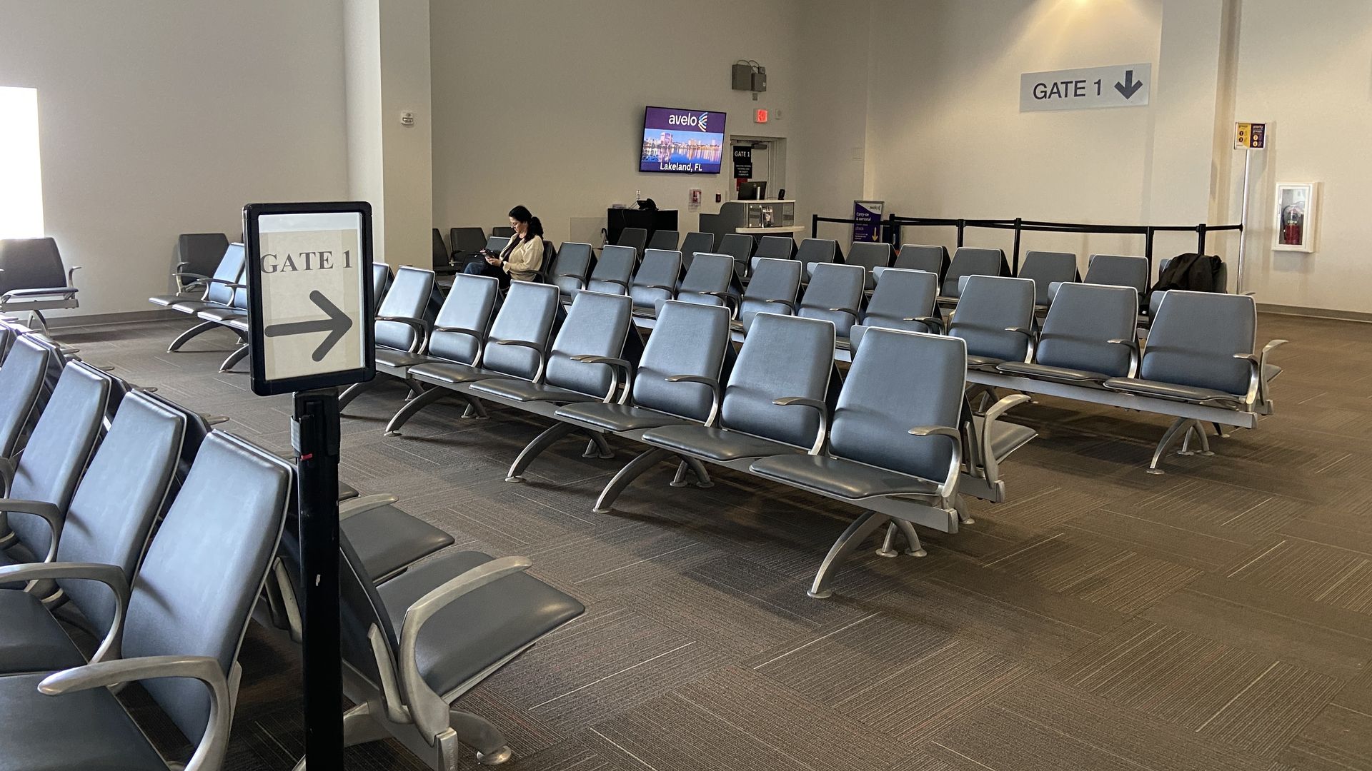 Gate 1 at Concord. Most of the seats are empty. 