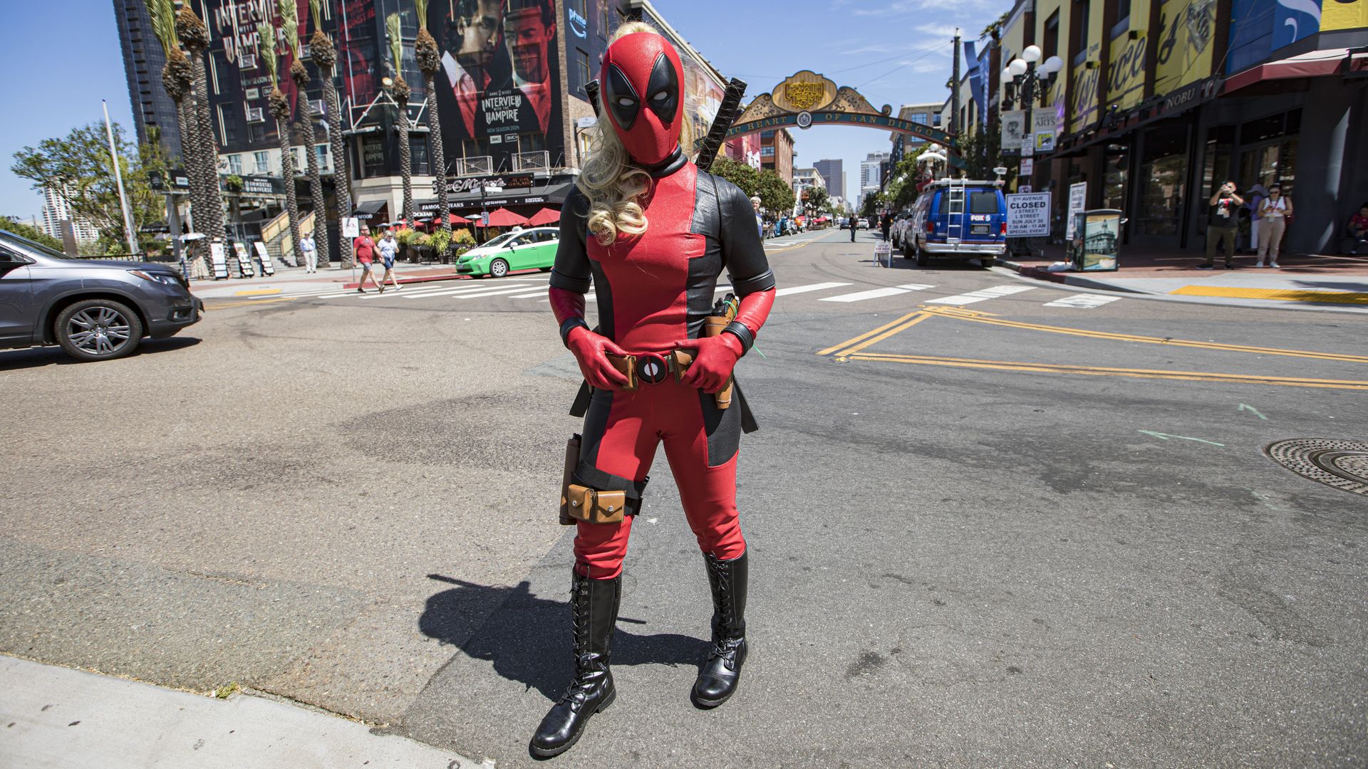 A cosplayer as Deadpool with long hair