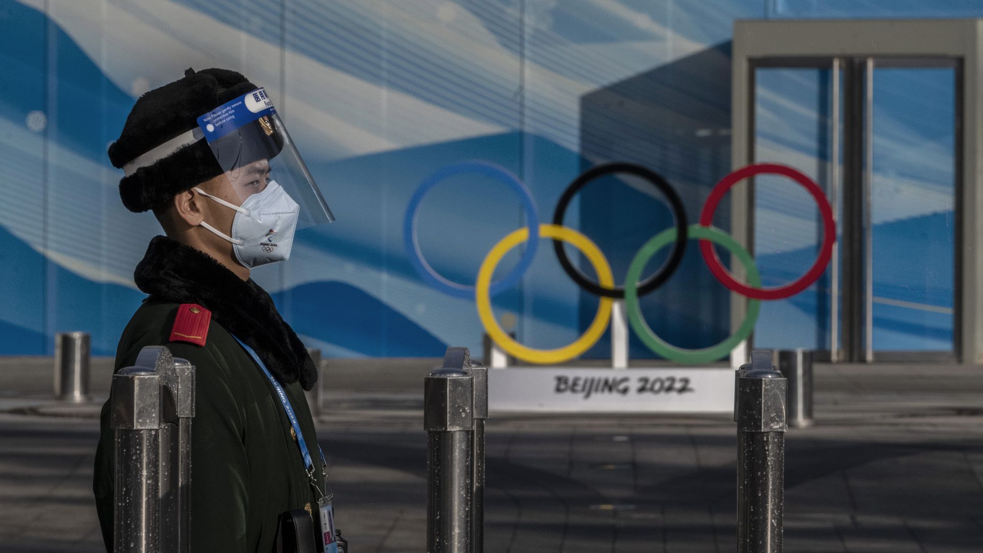 A police officer stands guard inside the closed loop bubble to protect against the spread of COVID-19 for the Beijing 2022 Winter Olympics near the main media center at the Olympic Park.