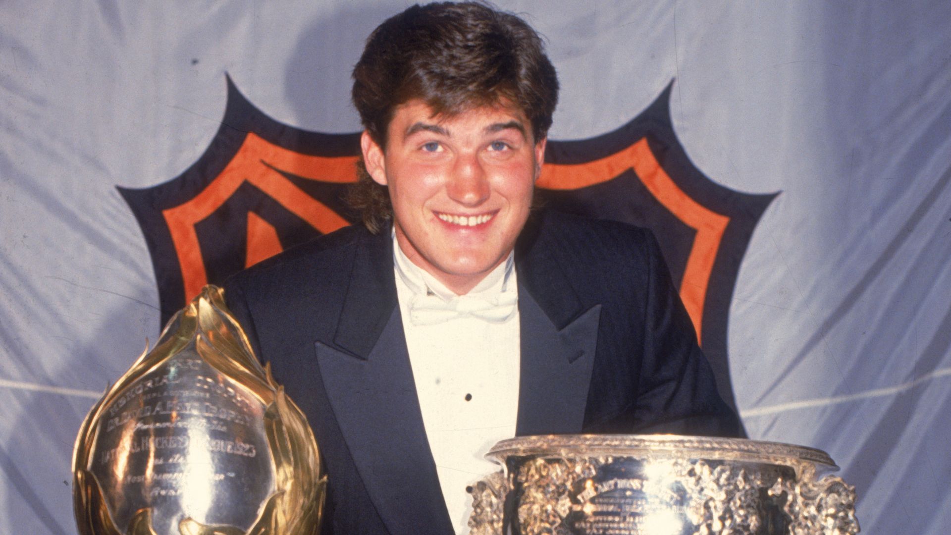 Mario Lemieux with the Hart Trophy and Art Ross Trophy