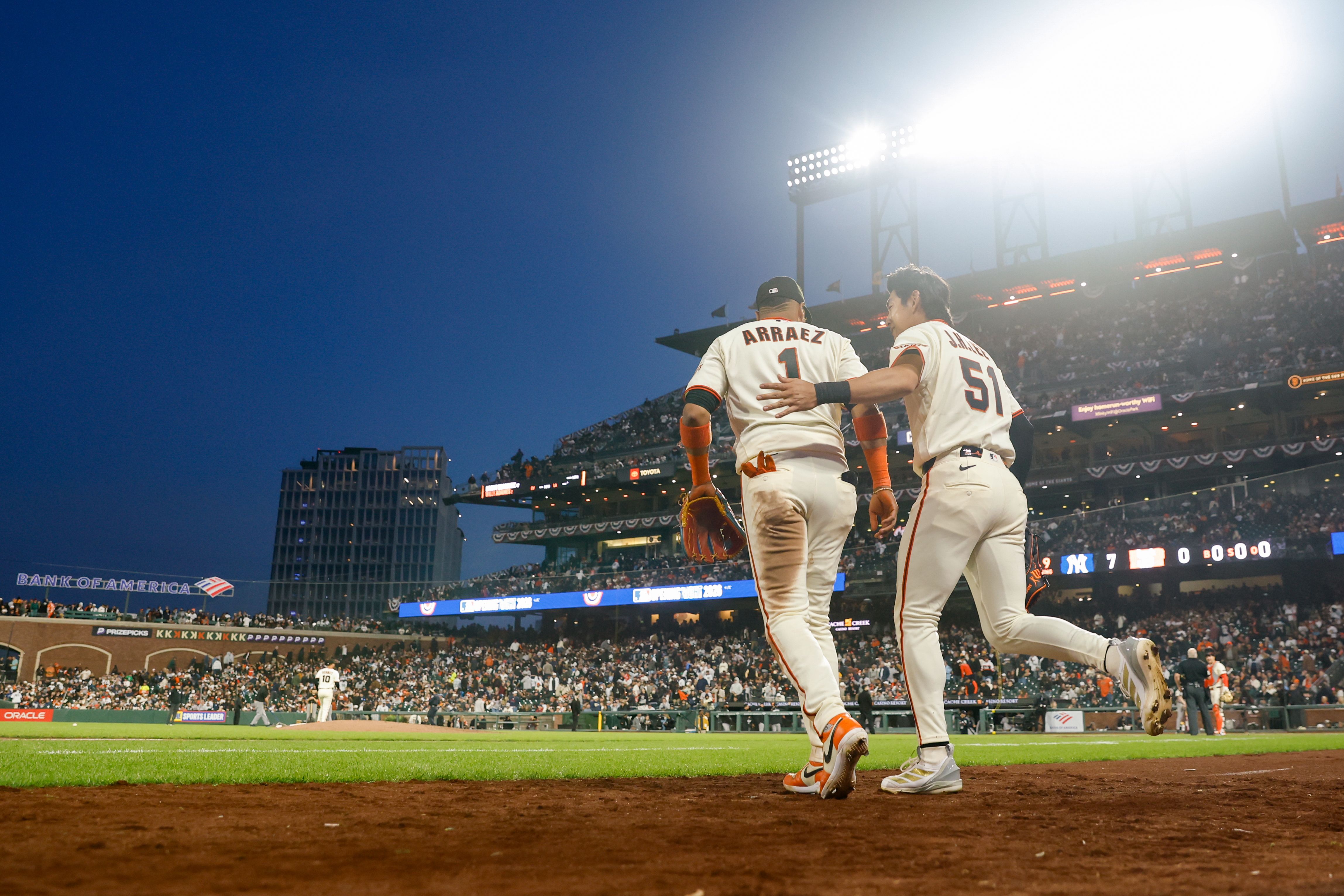 The San Francisco Giants' Luis Arraez and Jung Hoo Lee take the field at Oracle Park last night. Photo: Lachlan Cunningham/MLB Photos via Getty Images