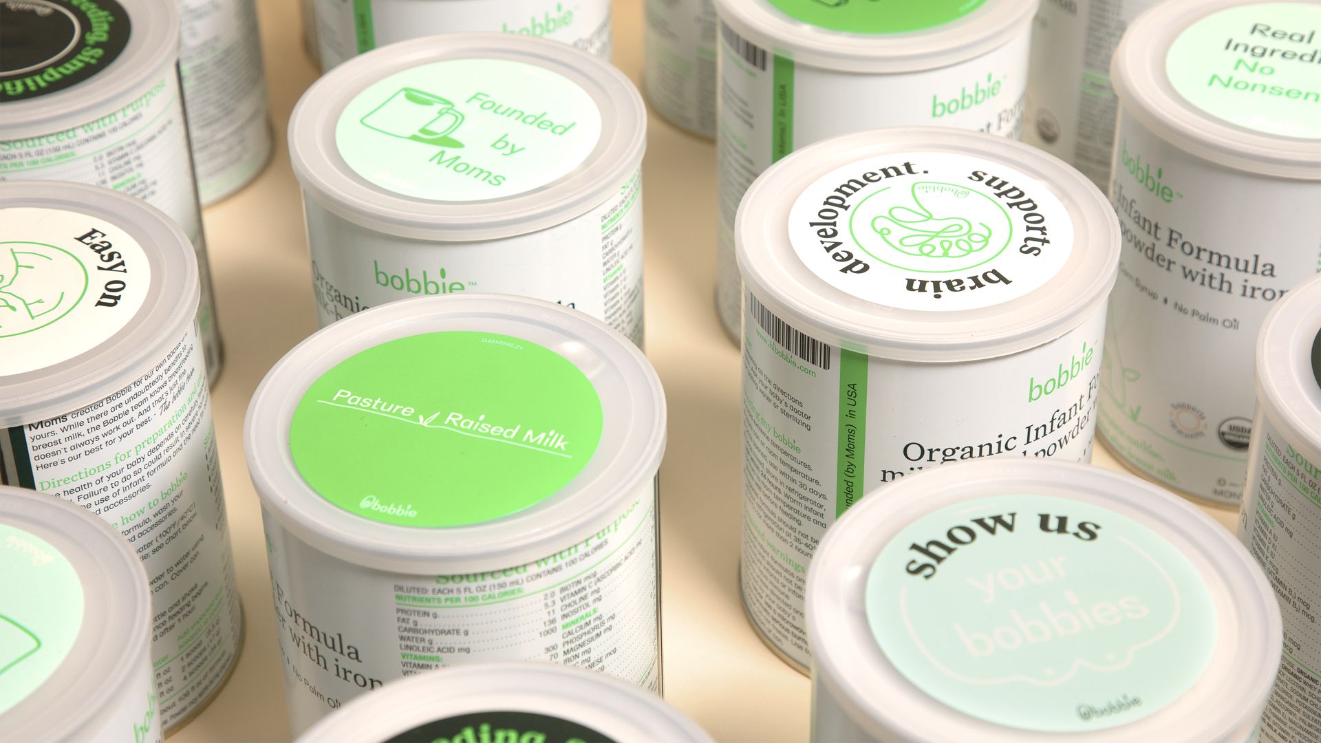 Round containers containing infant formula.