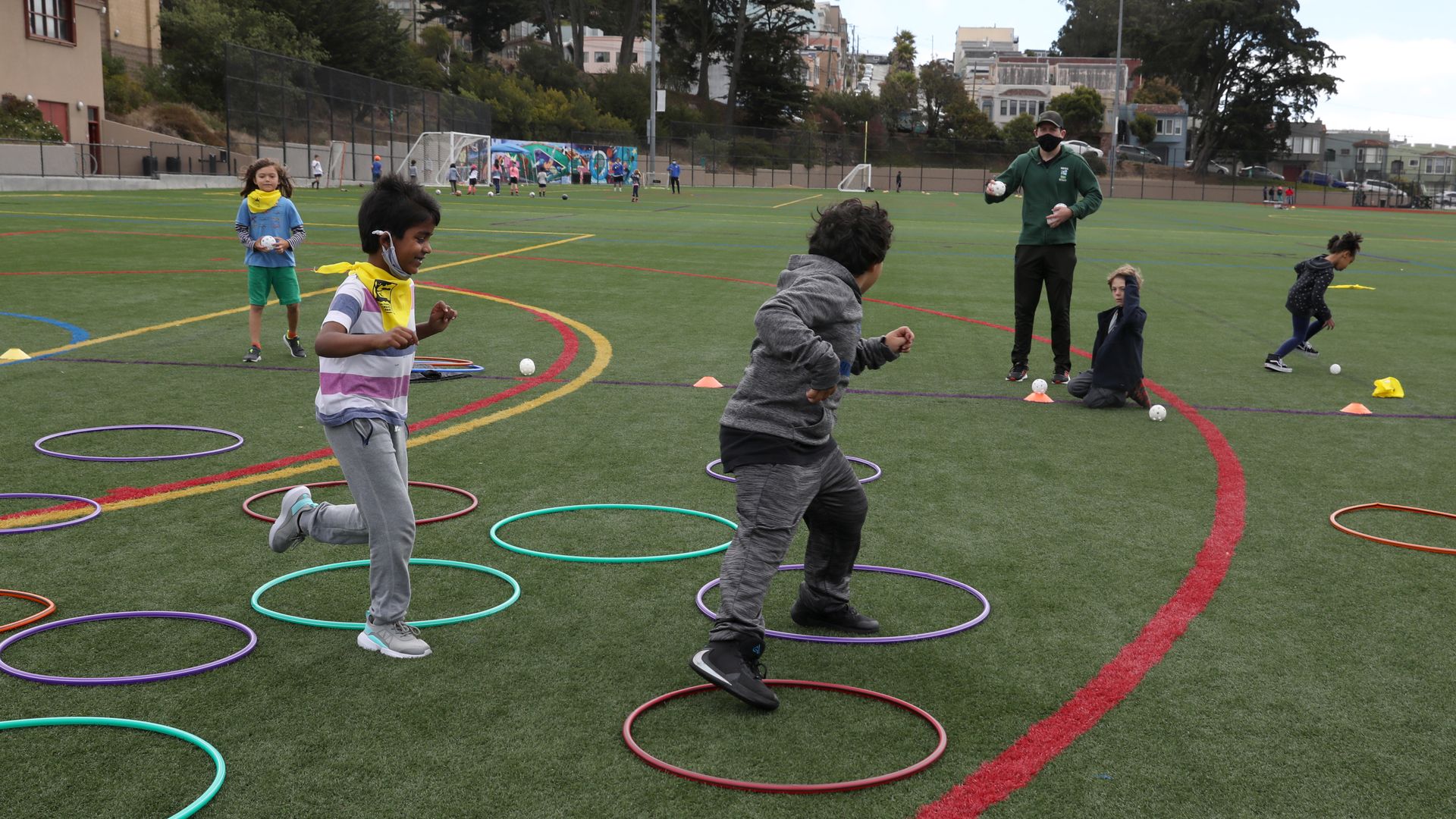 Children attend a learning hub at the Minnie and Lovie Ward Recreation Center as they play in the park on July 23