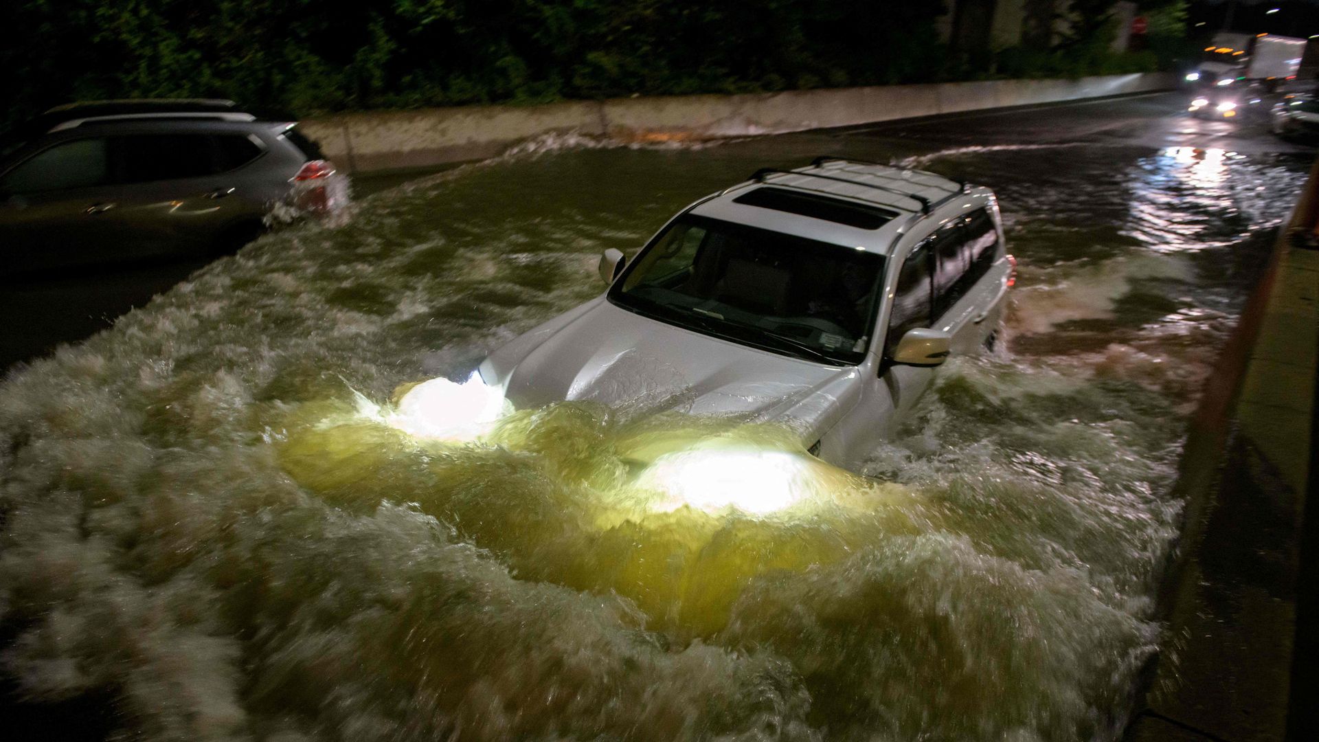 A car getting washed away in floodwaters in Brooklyn, New York.