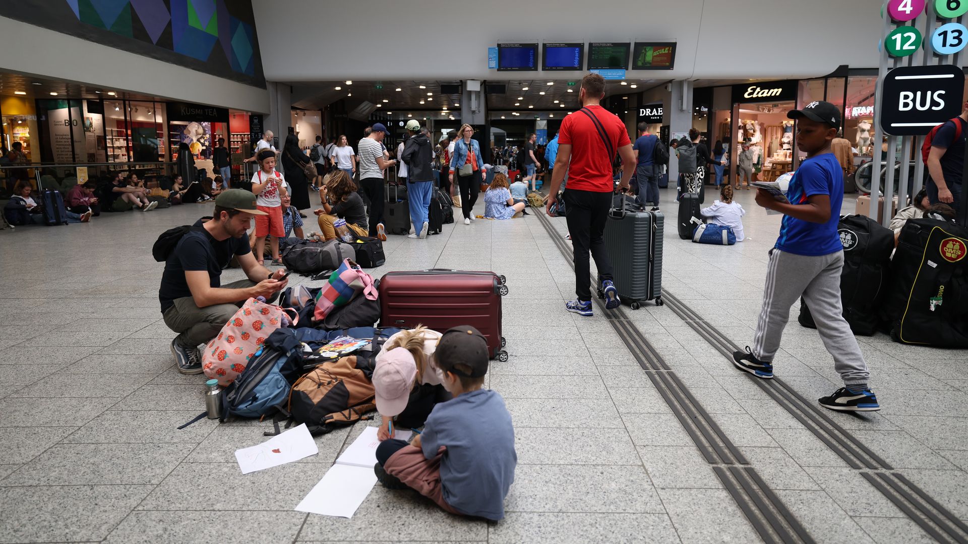 Sitting on train station floor