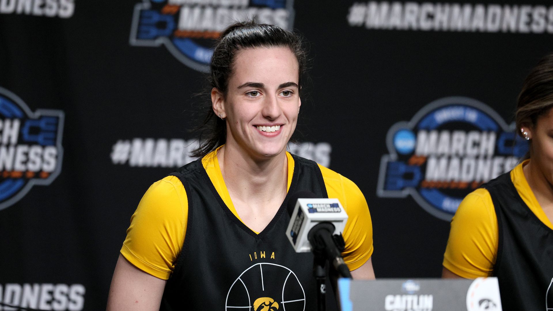 Caitlin Clark #22 of the Iowa Hawkeyes talks to the media following practice for the NCAA Women's Basketball Tournament 