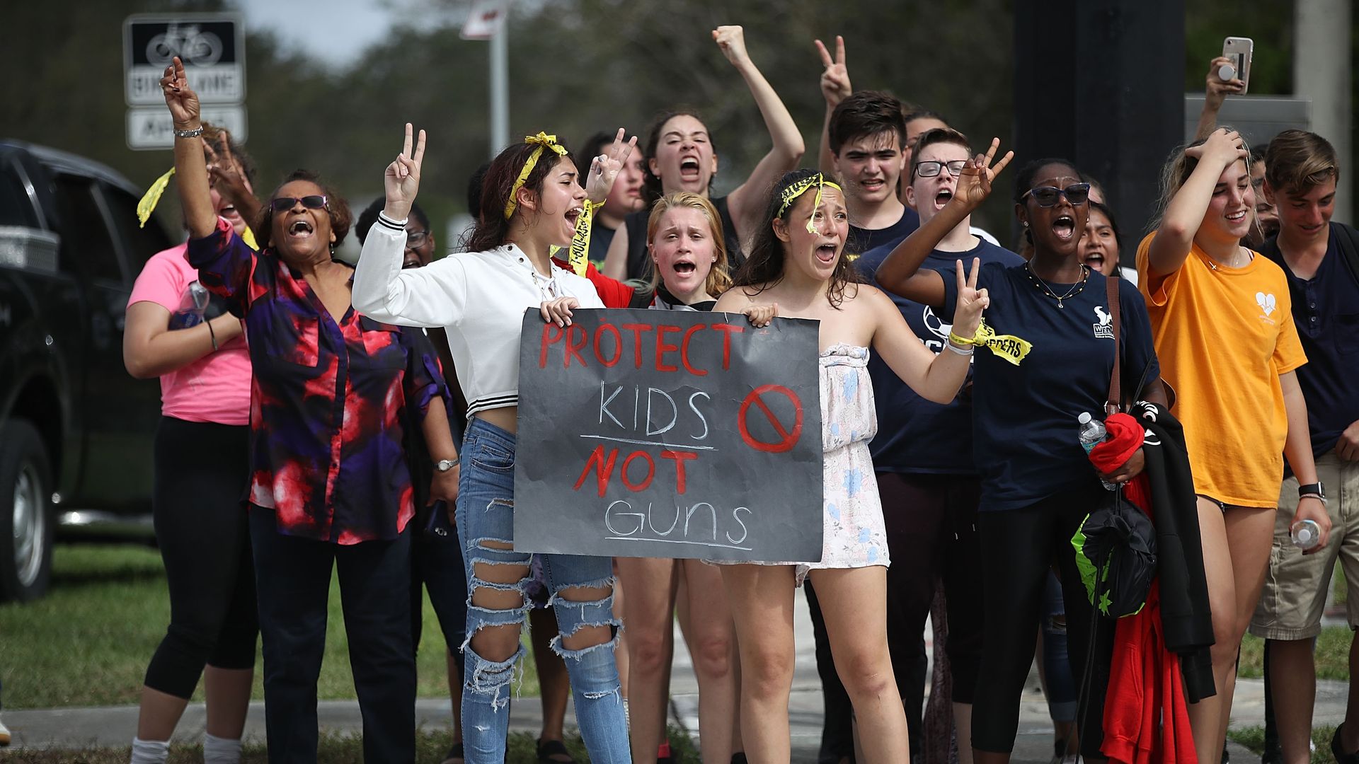 Students carry signs