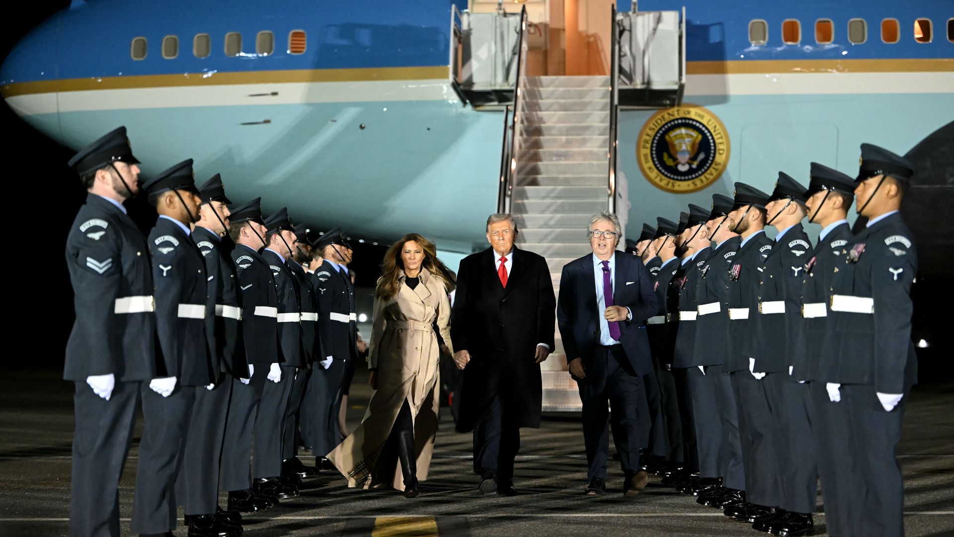 President Trump and Melania Trump walking off a plane in Heathrow