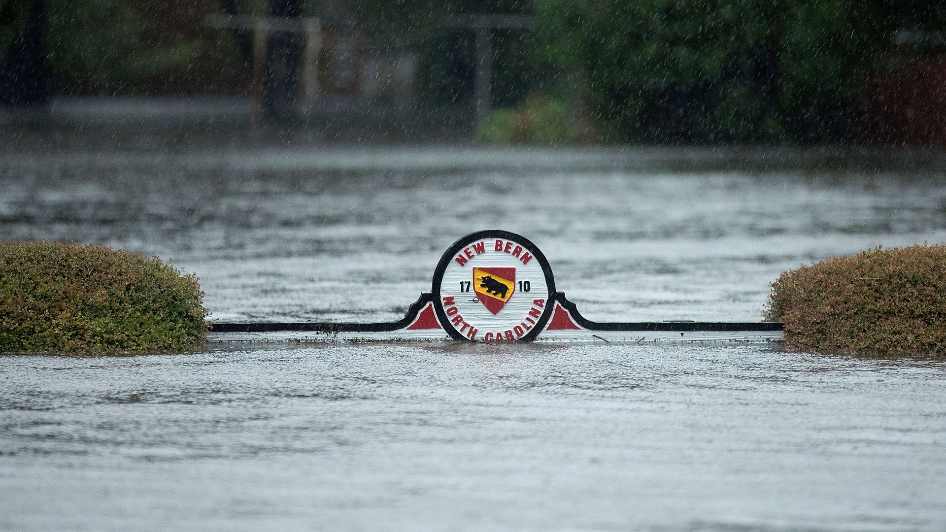 A sign for New Bern, North Carolina, almost under water.