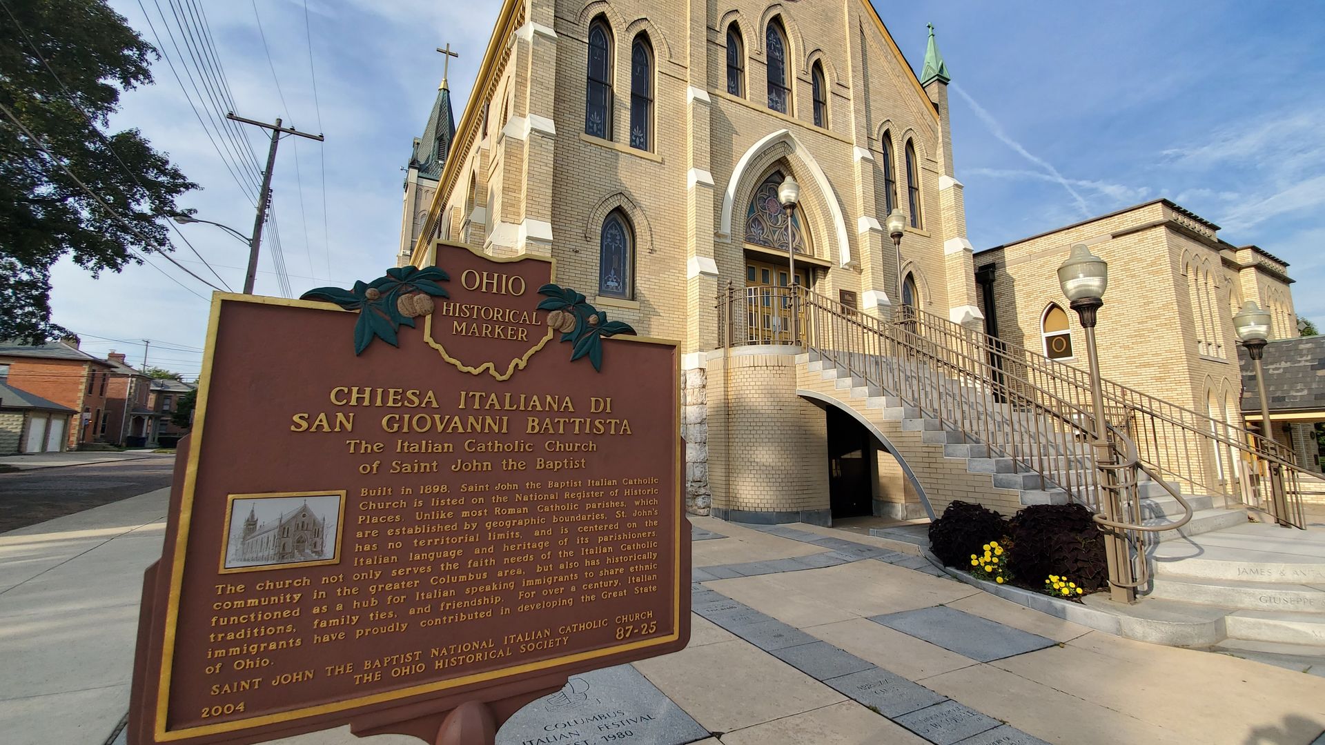 A historical marker in front of an old church in Columbus' Italian Village.