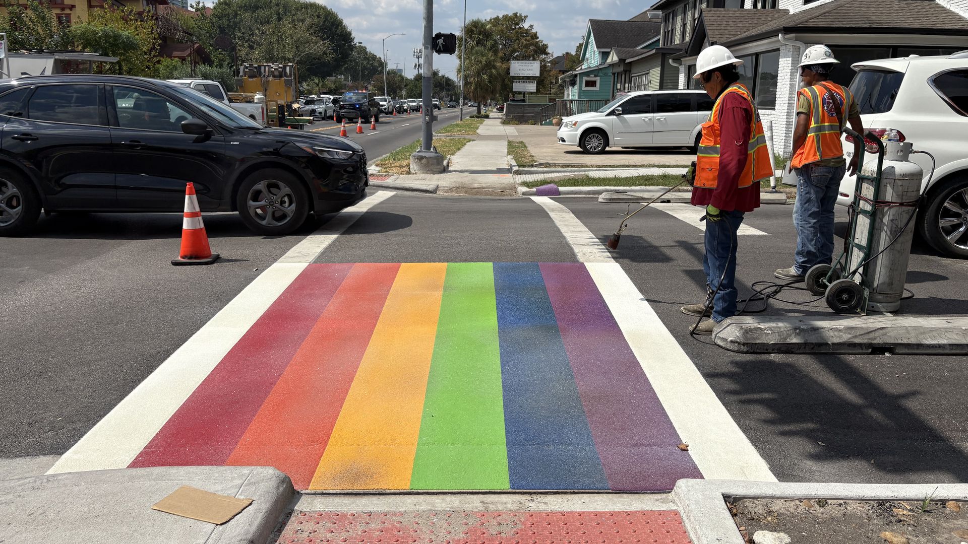Workers repaint a rainbow inside the crosswalk at Westheimer Road and Taft Street in Houston's Montrose neighborhood