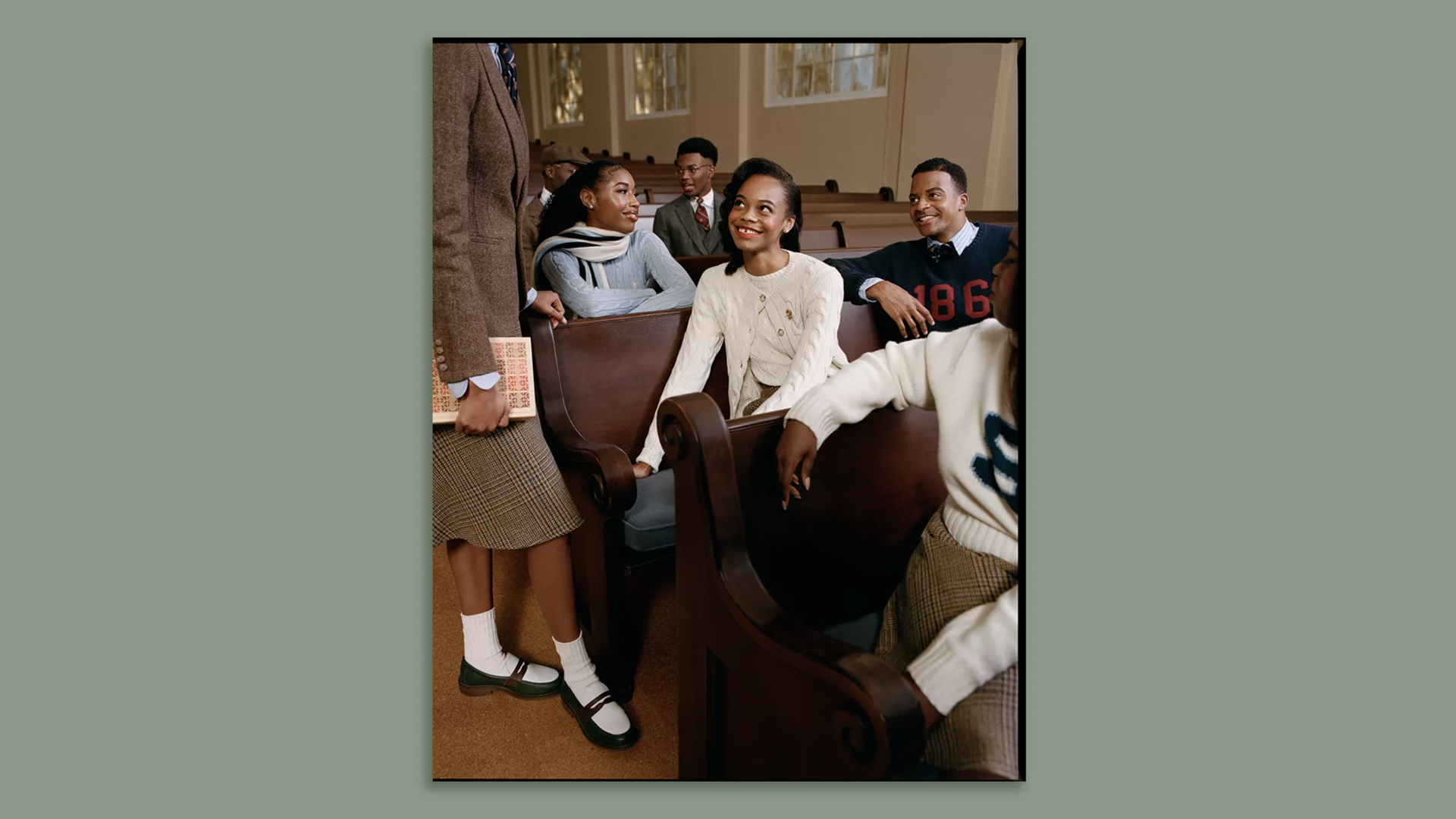 Students sit in pews wearing fashion from the 1920-50s designed by Ralph Lauren to honor Morehouse and Spelman