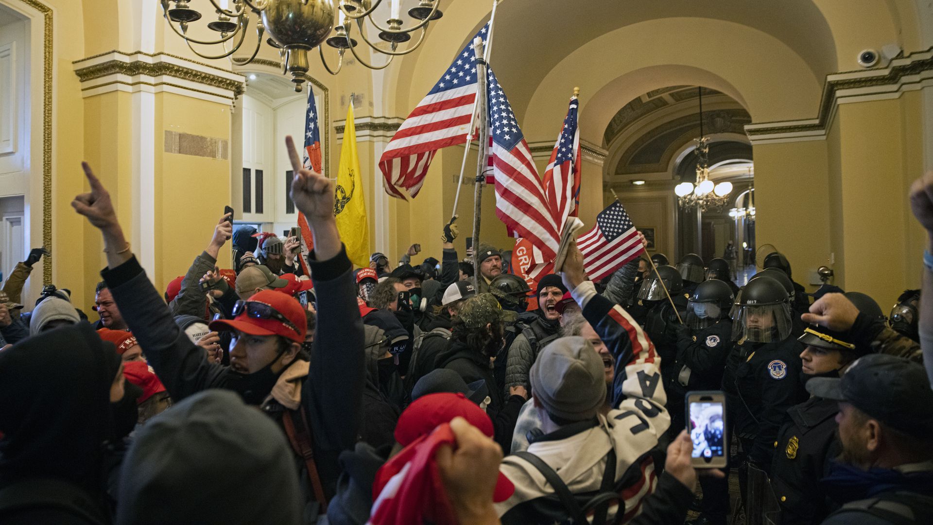Photo of Trump supporters crowded into a hallway in the Capitol building