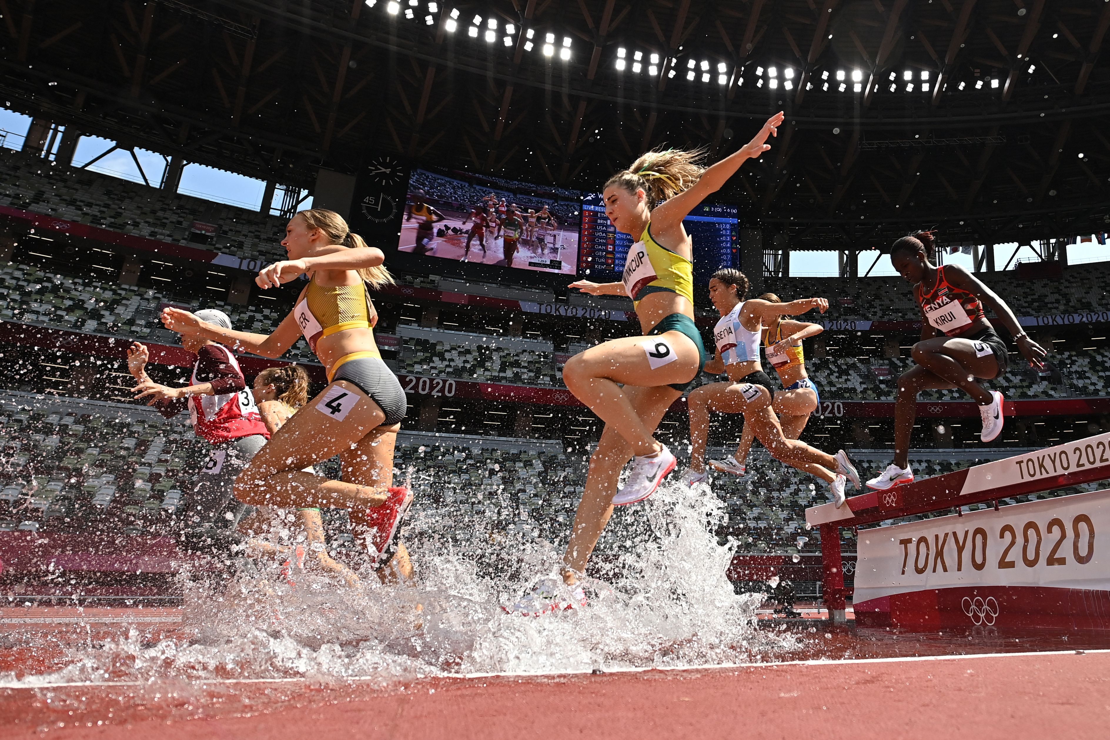 Australia's Georgia Winkcup (C) competes in the women's 3000m steeplechase heats during the Tokyo 2020 Olympic Games at the Olympic Stadium in Tokyo on August 1