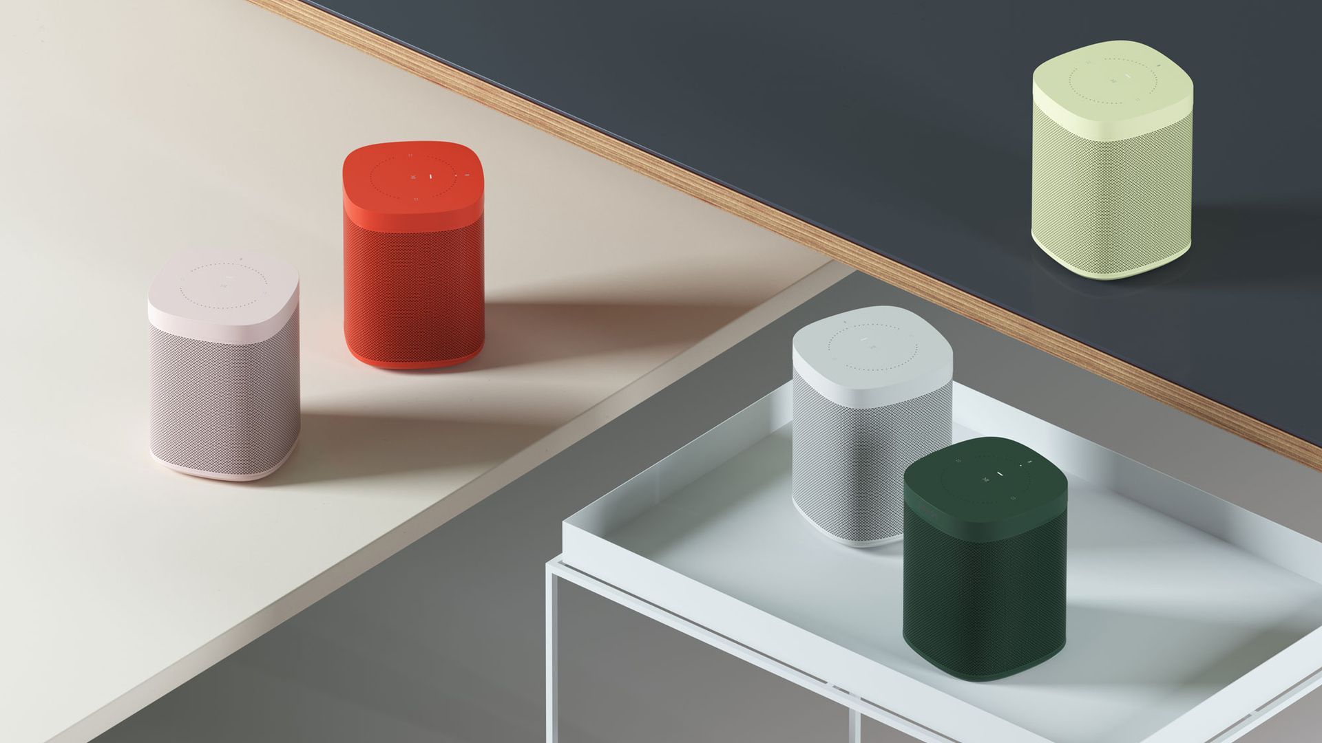 A lifestyle shot with various Sonos speakers