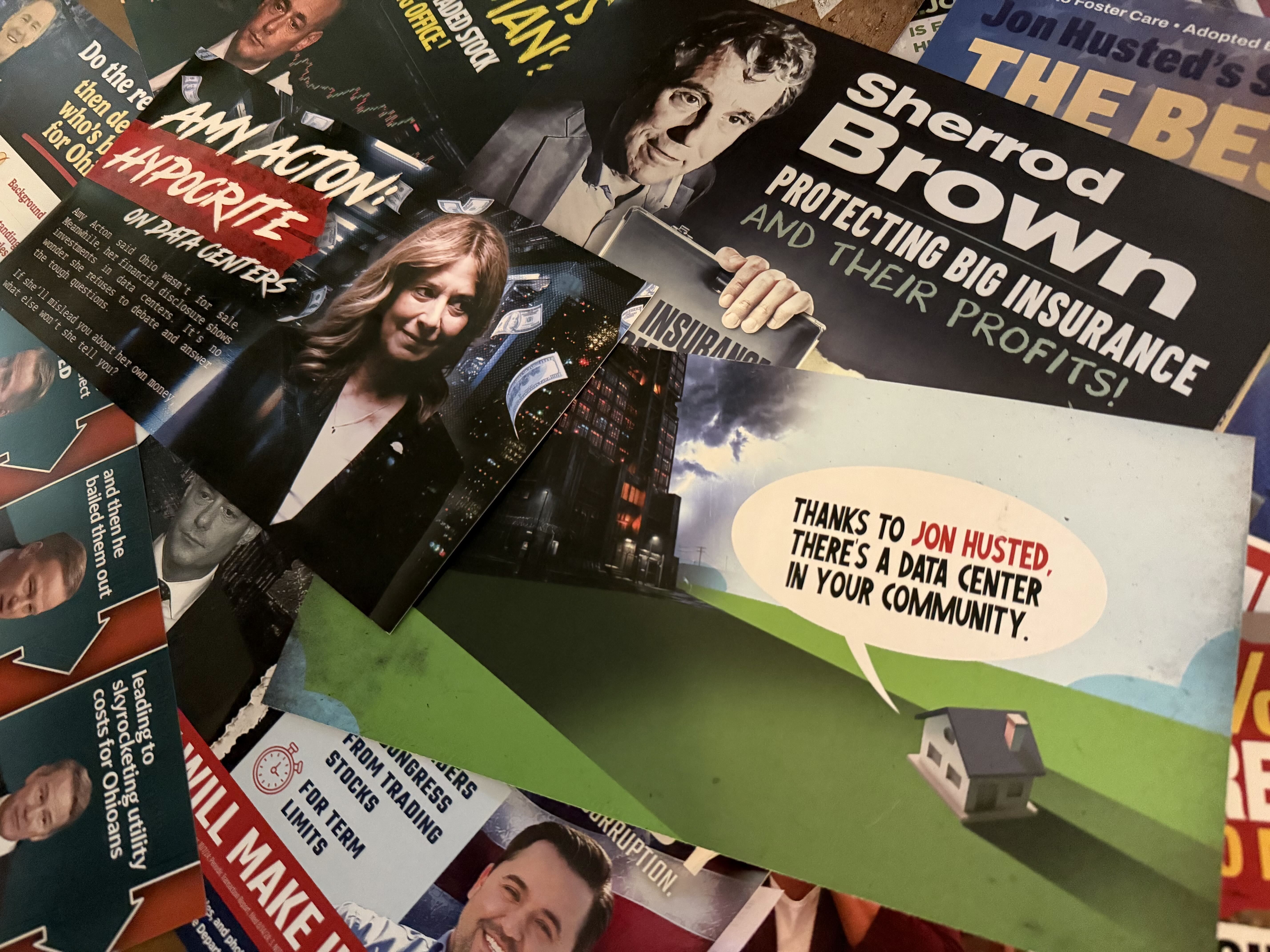 A collage of overlapping magazines and posters with bold headlines and portraits, including a man in a suit and a smiling woman; colors are black, white, red, blue, and green.