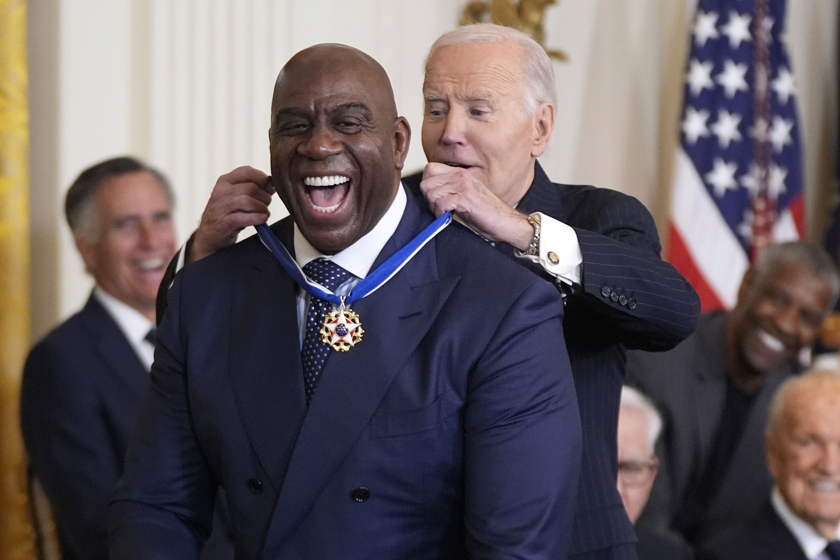 President Joe Biden, right, presents the Presidential Medal of Freedom, the Nation's highest civilian honor, to Earvin "Magic" Johnson in the East Room of the White House, Saturday, Jan. 4, 2025, in Washington. (AP Photo/Manuel Balce Ceneta)