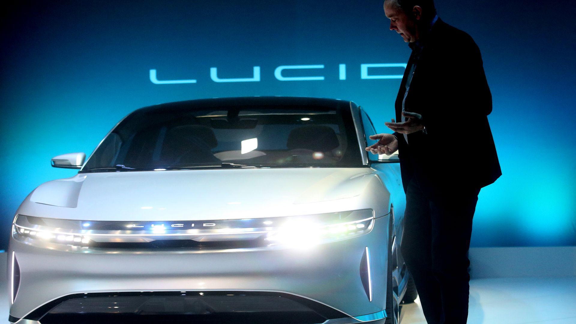 Man standing by a car