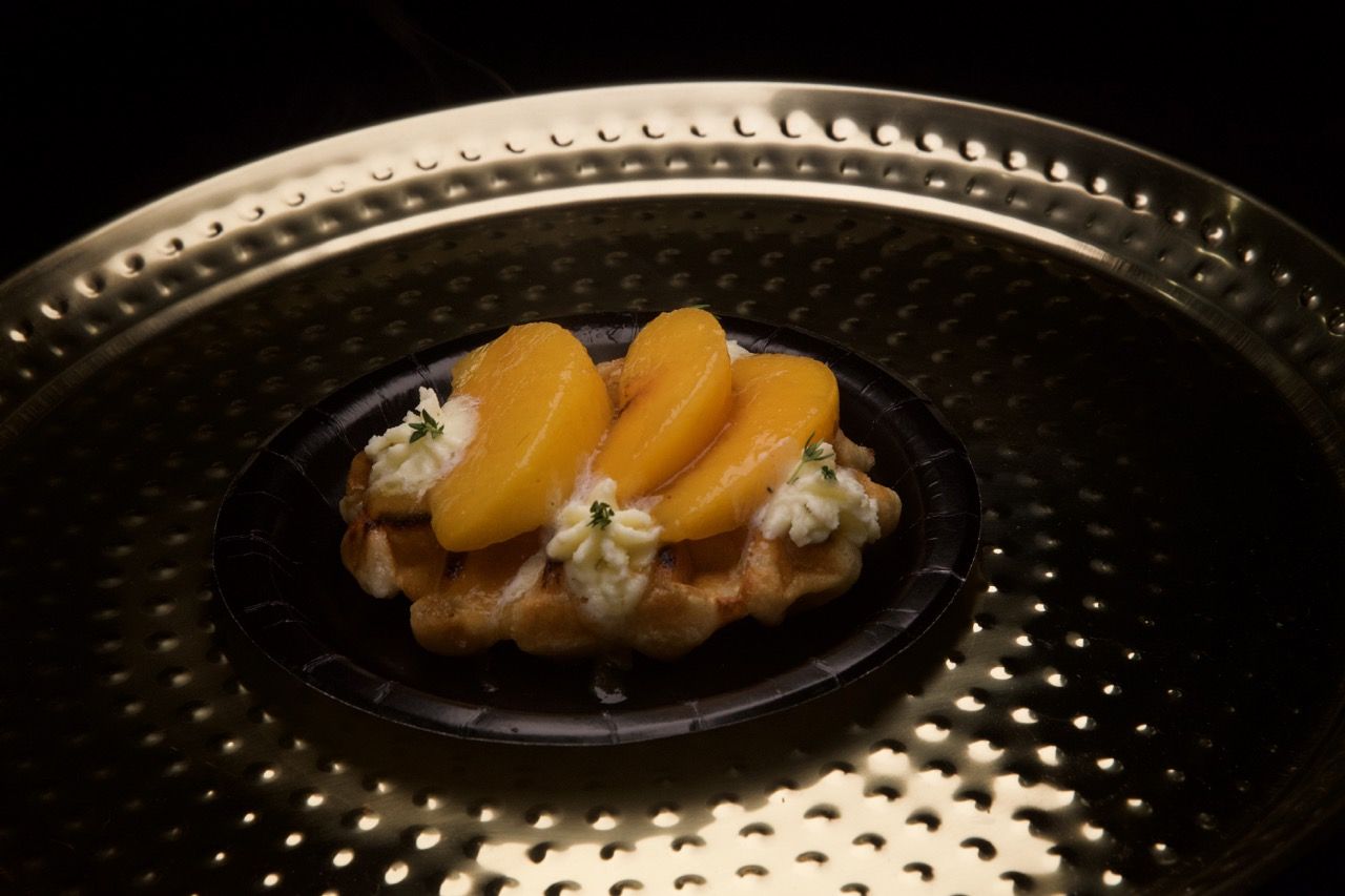 a peach waffle with cream