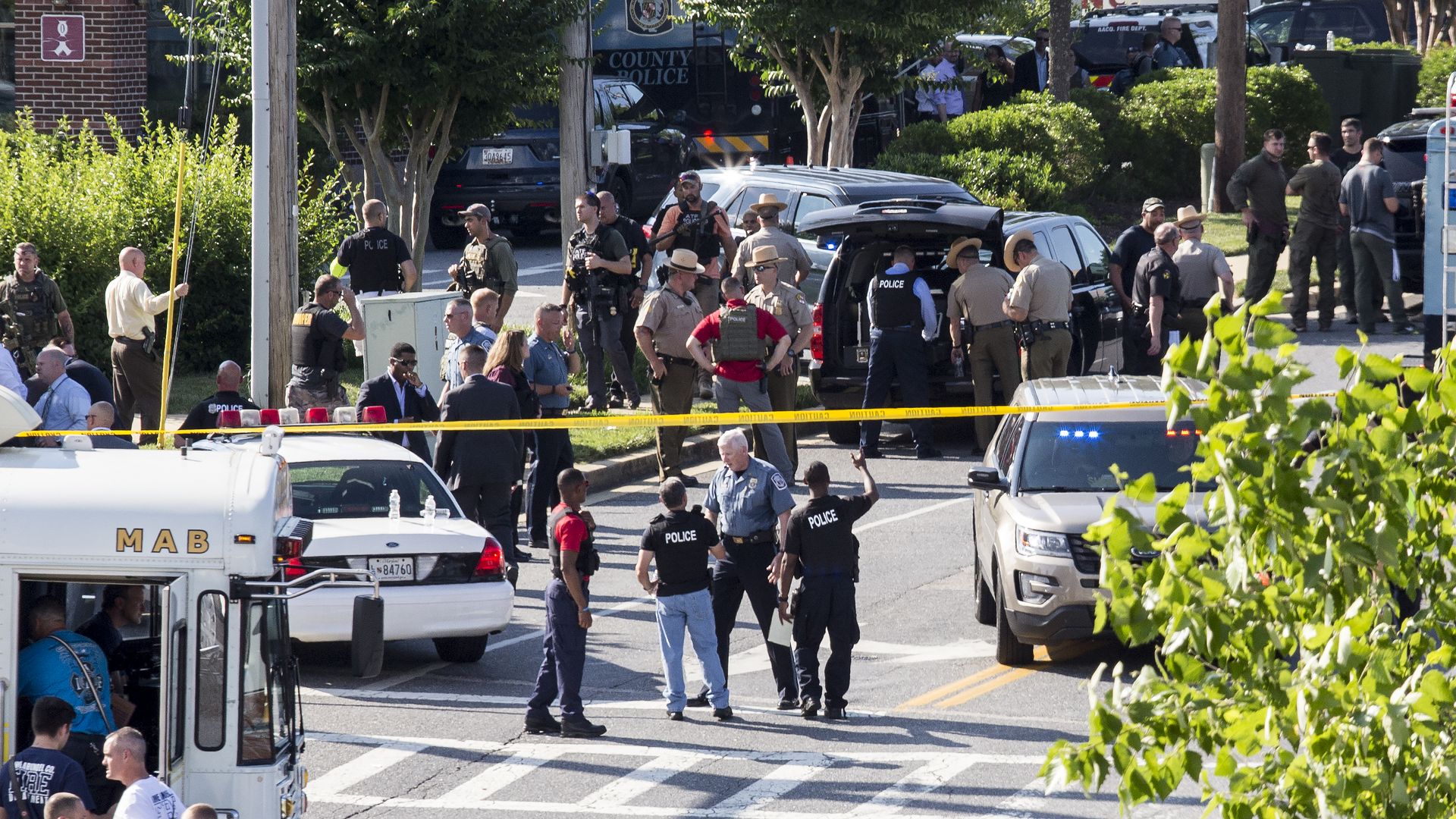 Police and press gathered on the scene of the shooting in Annapolis, Maryland.