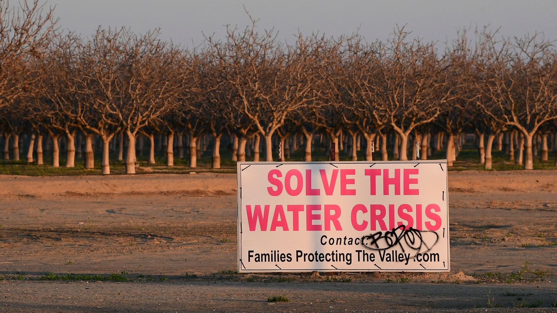 A sign calls for solving California's water crisis on the outskirts of Buttonwillow in California's Kern County on April 2, 2021