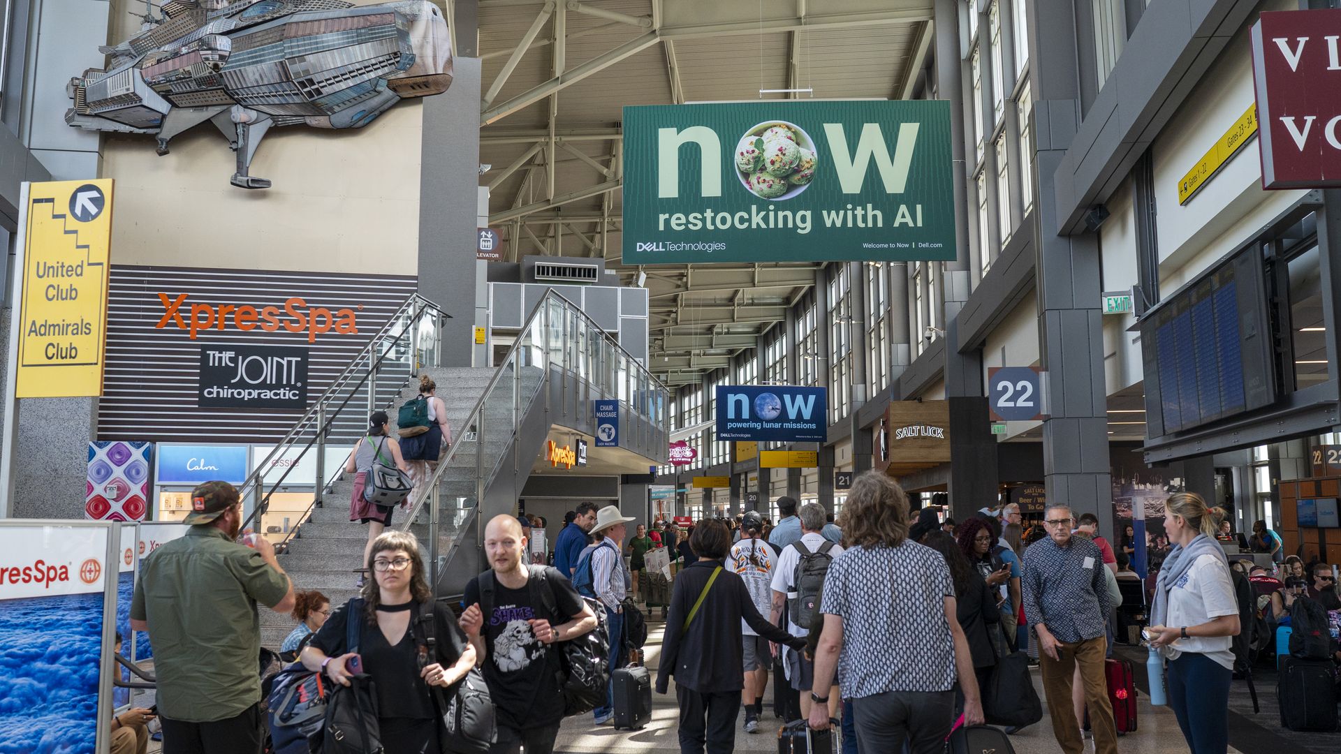 Travelers making their way through the Austin airport.