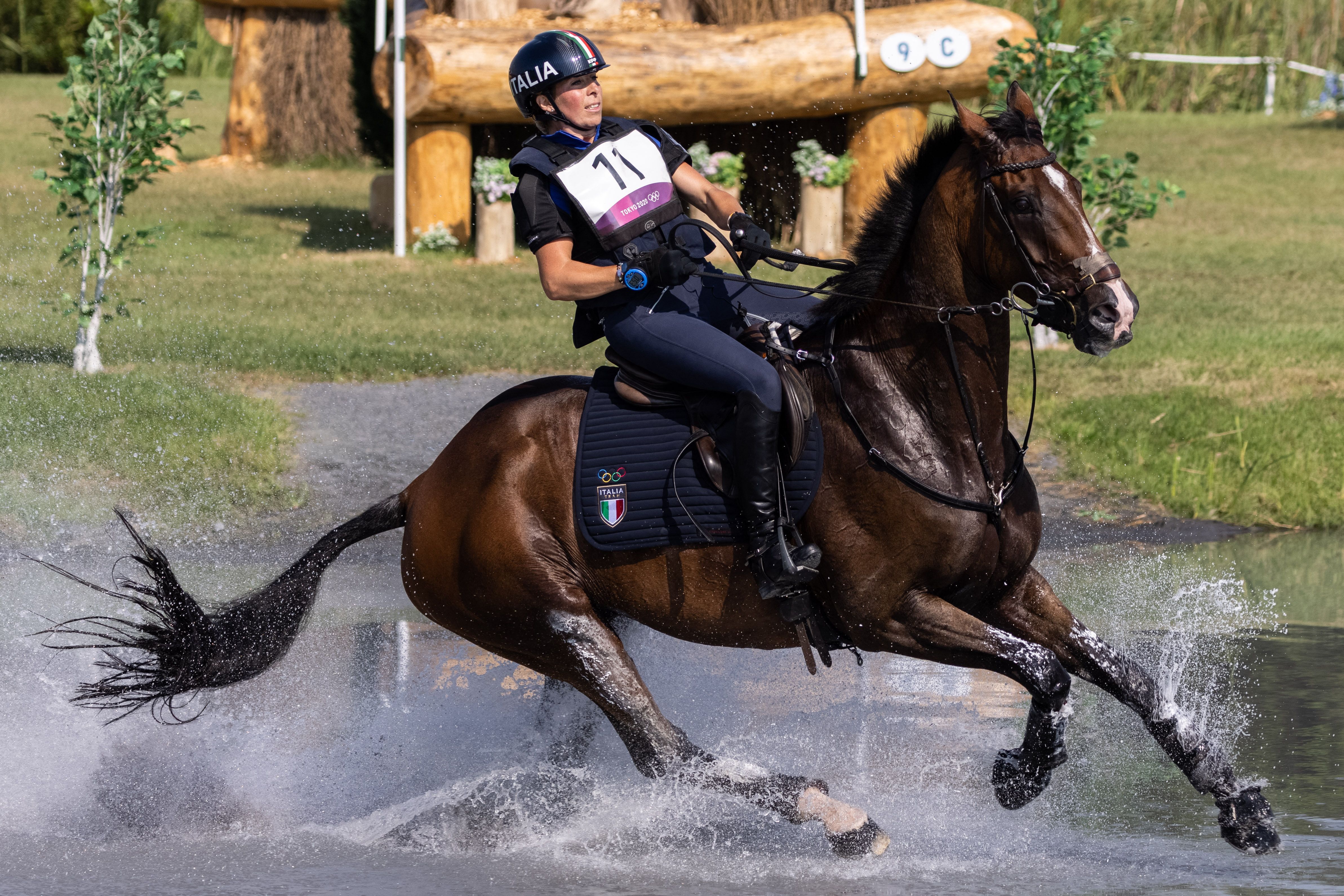 Italy's Vittoria Panizzon riding Super Cillous competes in the equestrian's eventing team and individual cross country  at the Sea Forest Cross Country Course in Tokyo on August 1