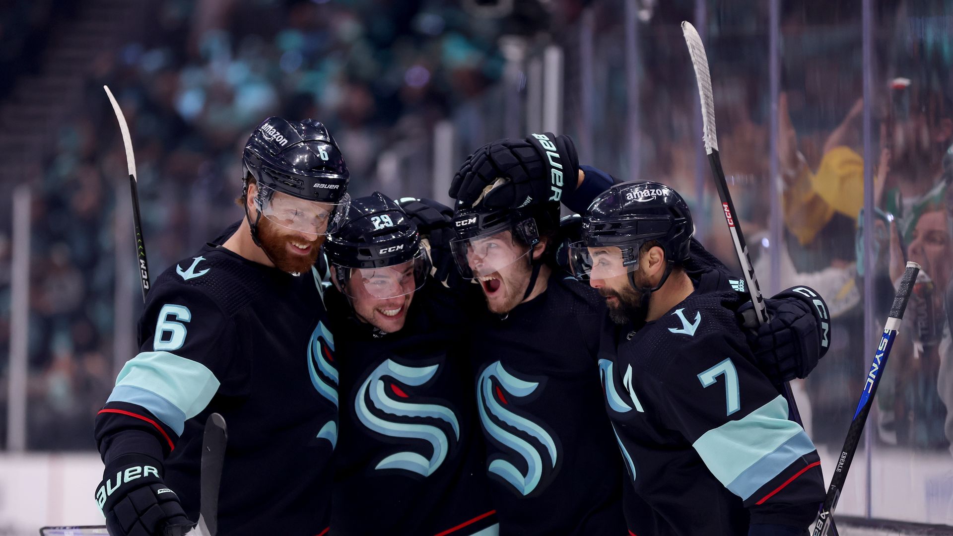 Seattle Kraken hockey players celebrate a goal during the 2023 Stanley Cup playoffs. 