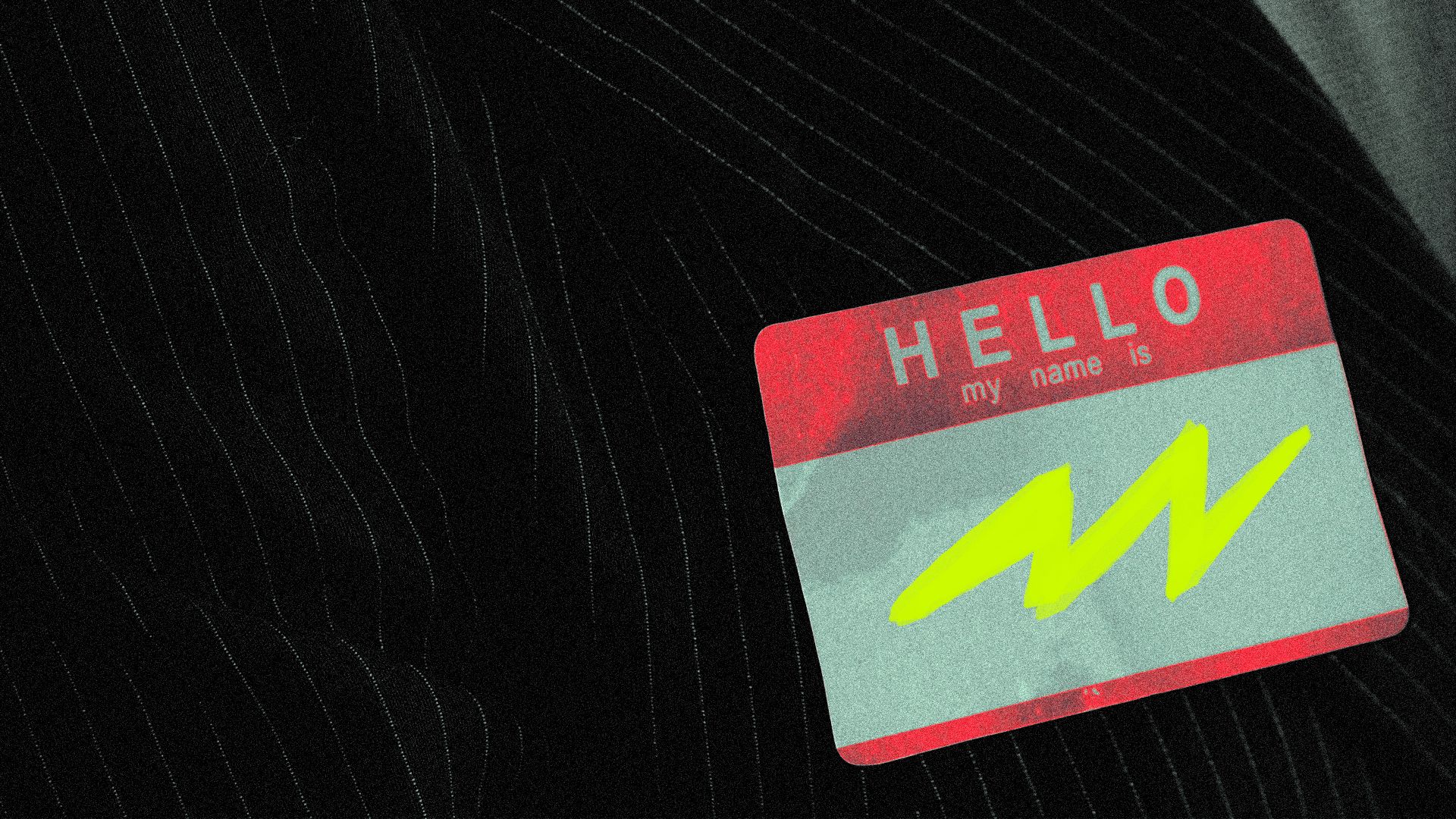 Illustration of a suit lapel with a name tag on it that reads "HELLO my name is," and has a lightning bolt scribbled in marker where the name should be.
