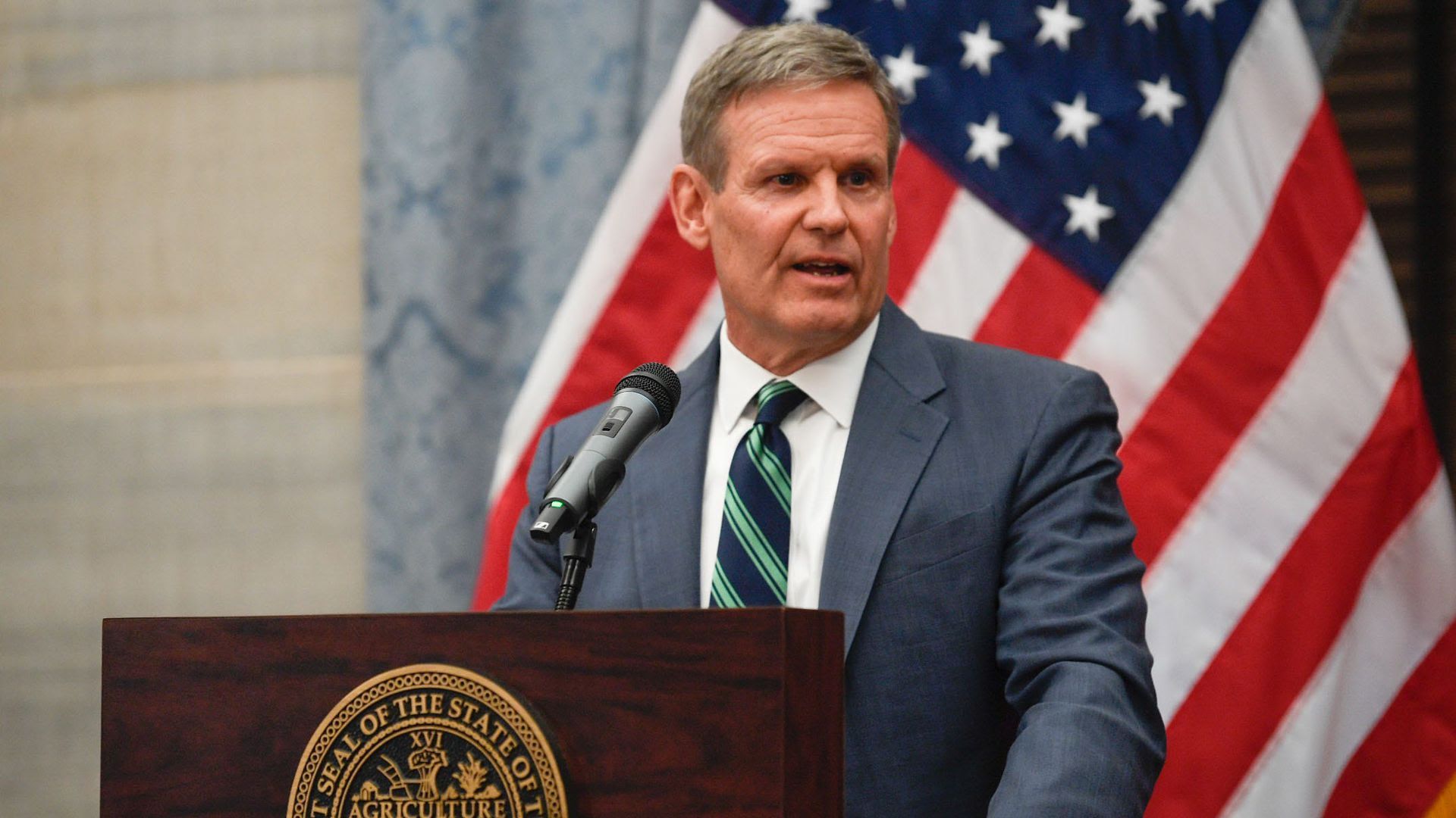 Gov. Bill Lee talking at a podium