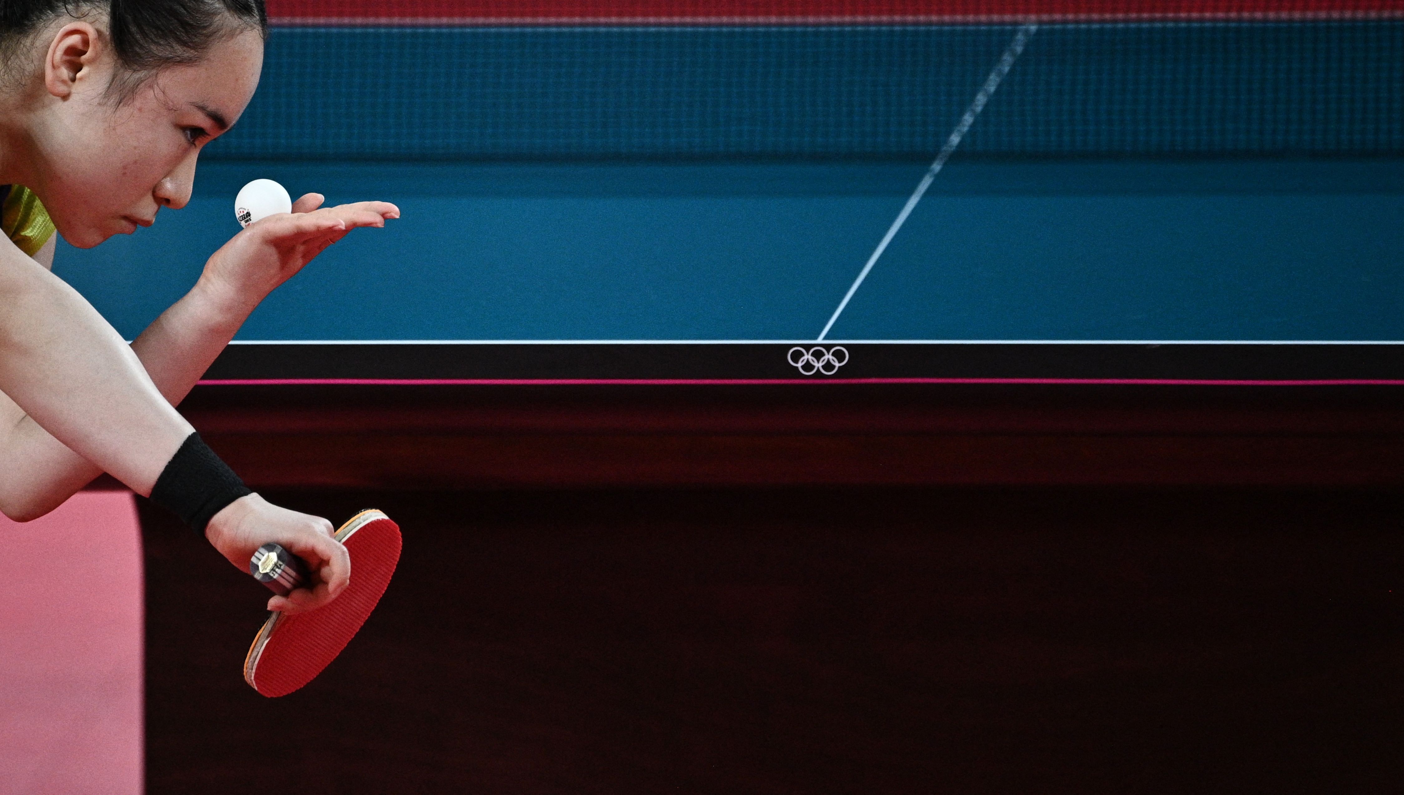 Japan's Mima Ito serves to China's Sun Yingsha during their women's singles semifinals table tennis match  during the Tokyo 2020 Olympic Games July 29
