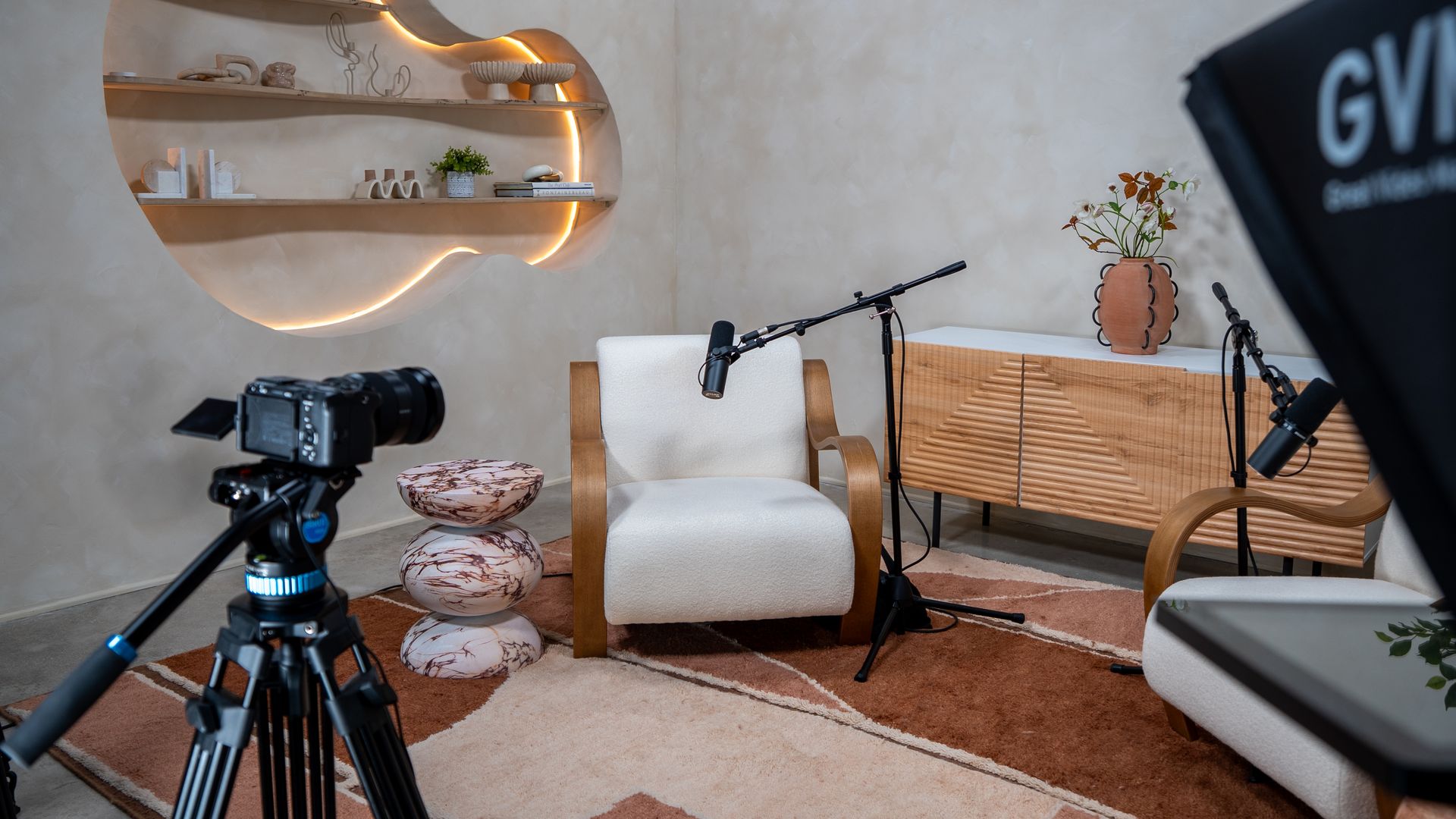 The Chat Room interior photo shows a couch with a microphone set up