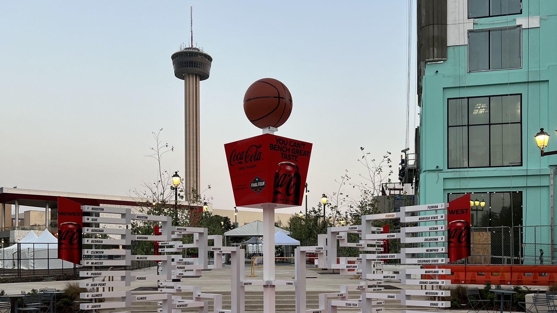 A view of the Tower of Americas with a real-life basketball bracket in the foreground.