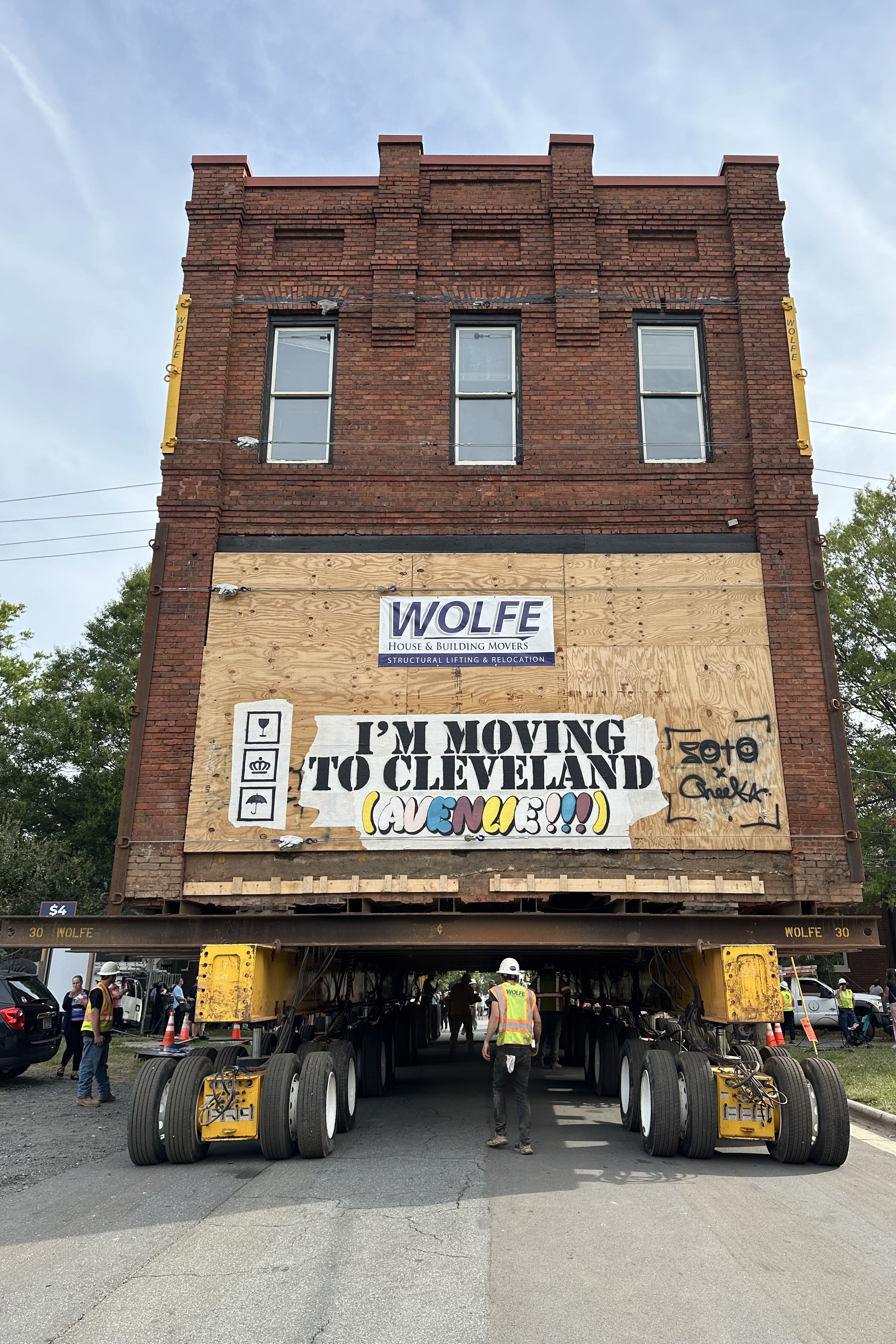Building with "I'm Moving to Cleveland Avenue" sign