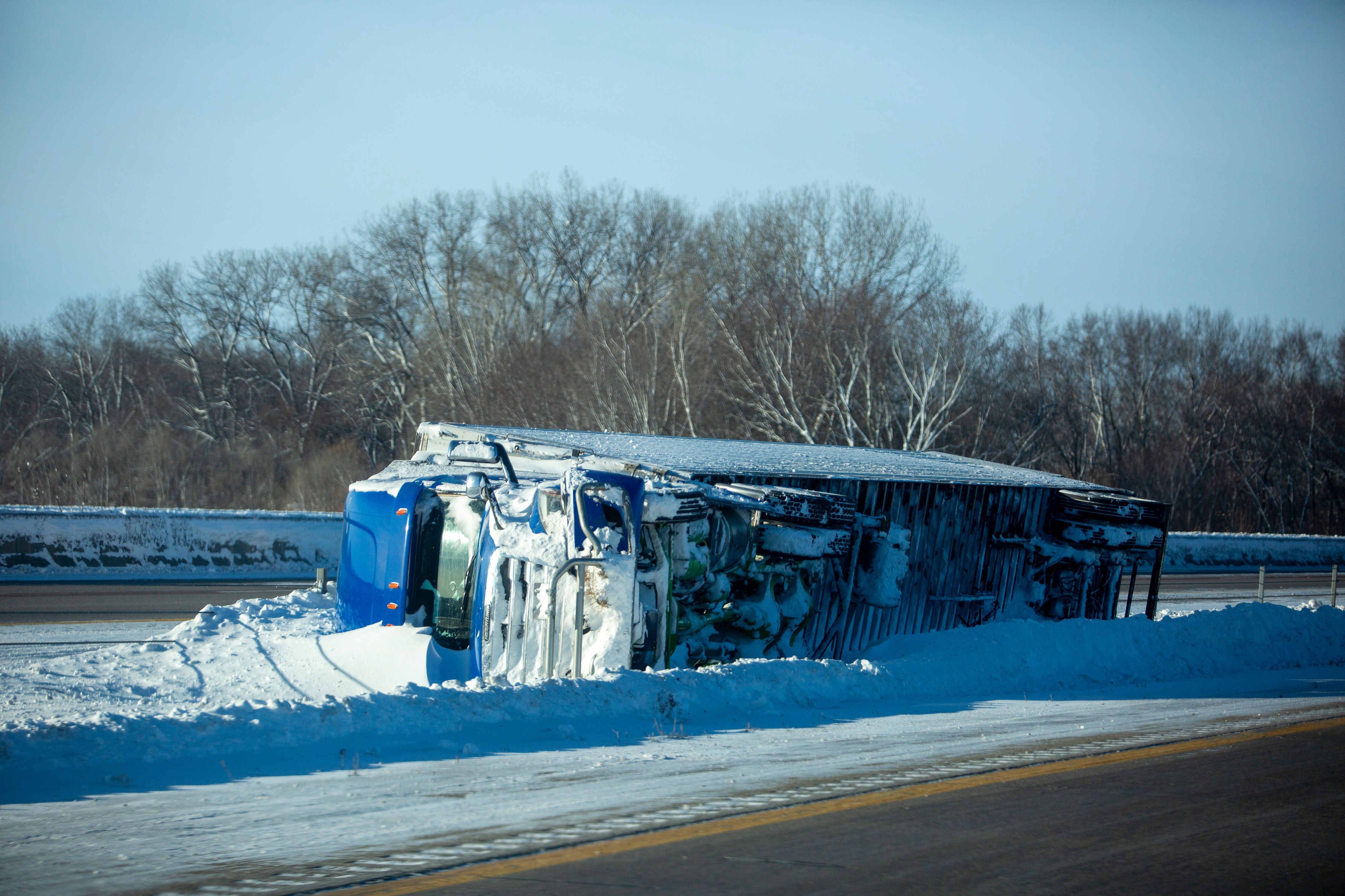An overturned tractor trailer Interstate 80 during a winter storm ahead of the Iowa caucus in West Des Moines, Iowa, US, on Sunday, Jan. 14, 2024. Iowans on Monday will cast the first votes in the 2024 presidential nominating process during a caucus that's likely to show depressed turnout because of historically frigid weather. 