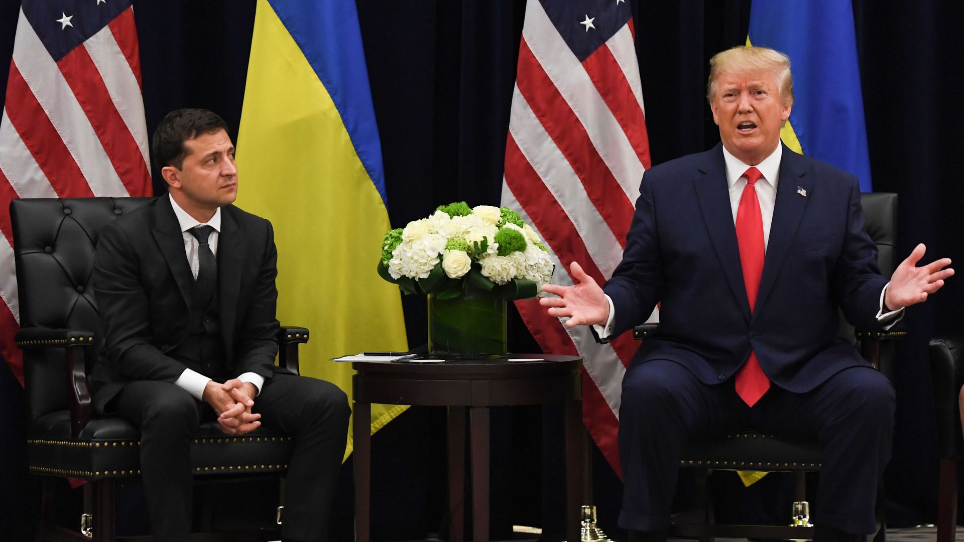  President Donald Trump speaks as Ukrainian President Volodymyr Zelensky looks on during a meeting