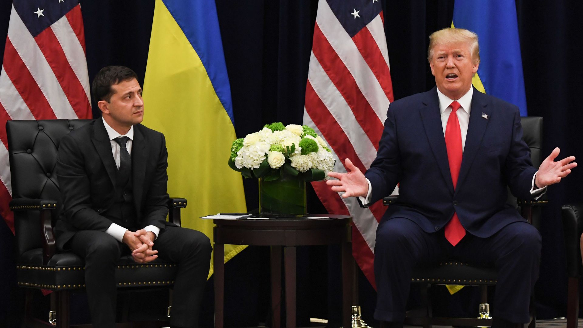 President Donald Trump speaks as Ukrainian President Volodymyr Zelensky looks on during a meeting