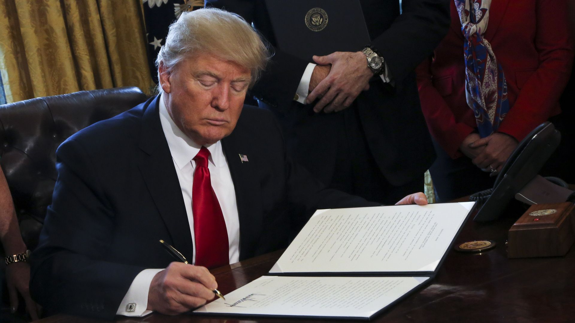 Trump signing an executive order