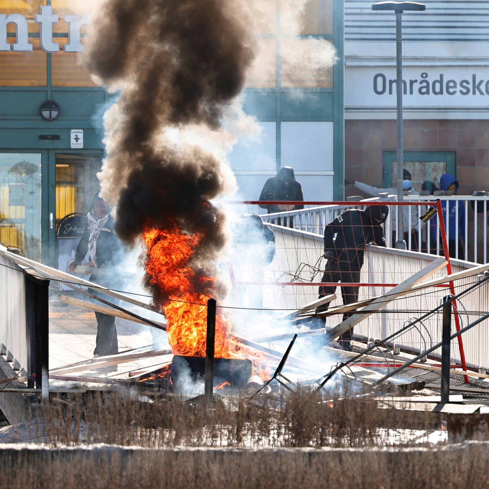  Protesters burn a barricade at the entrance to a shopping center during rioting in Norrkoping, Sweden on April 17.