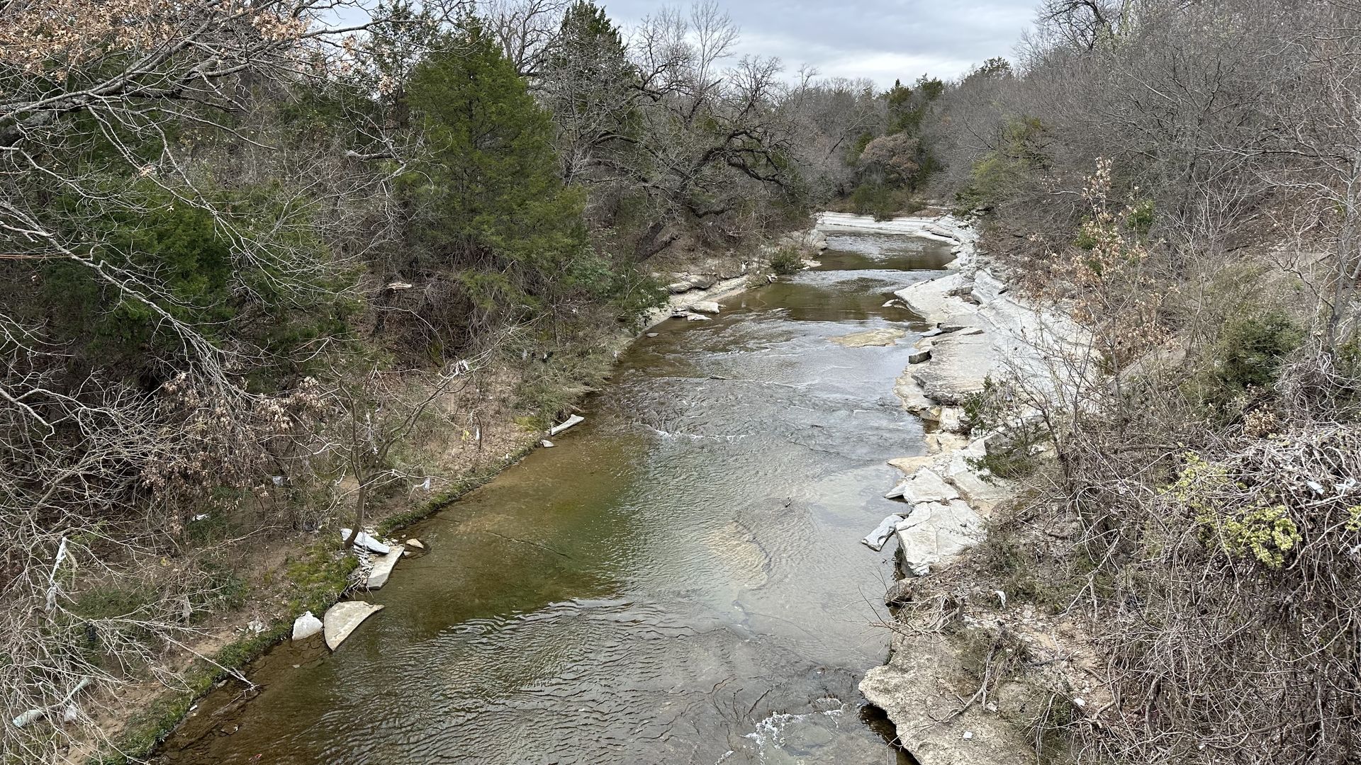 A photo of a tree-lined creek in Dallas, Texas