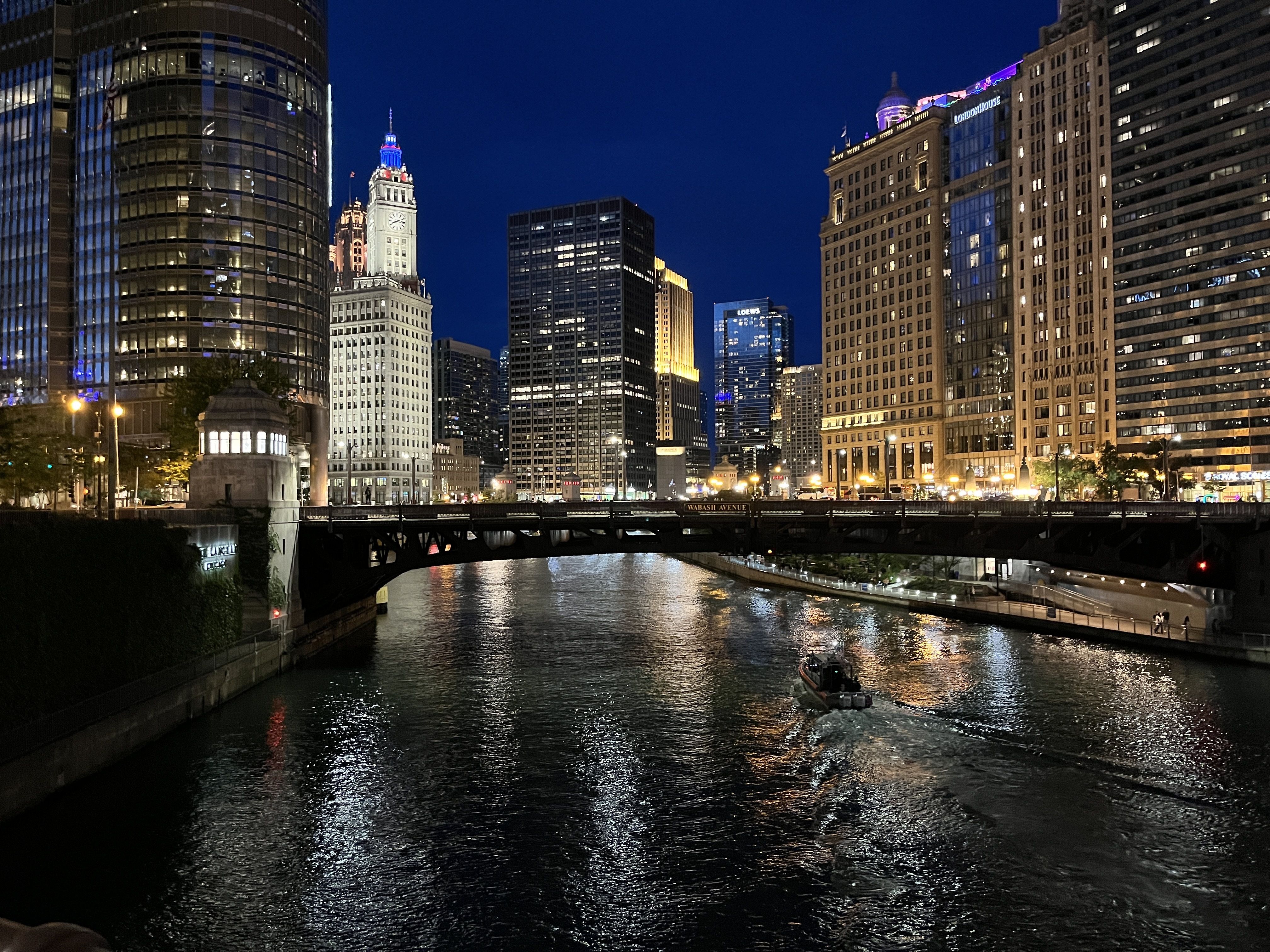 Photo of downtown river and buildings lit up at night