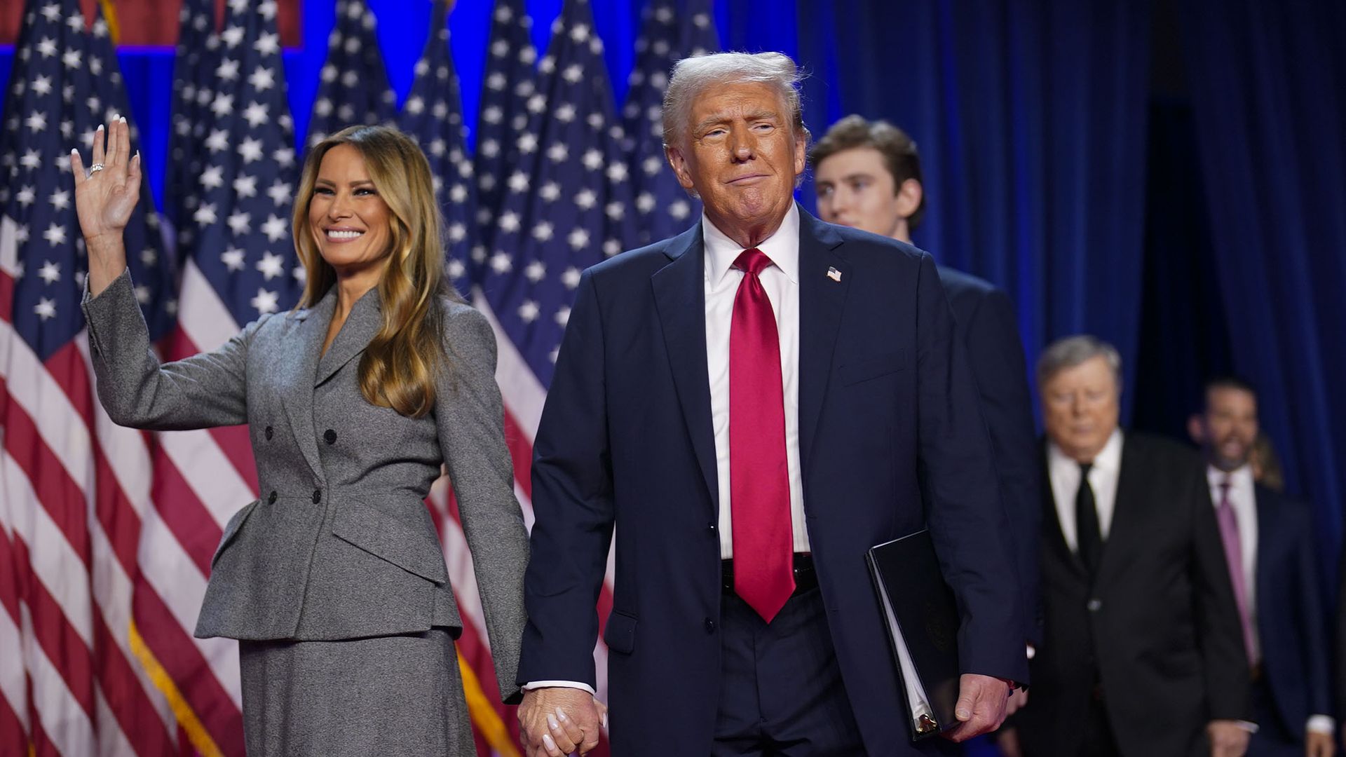President-elect Trump walks out on stage with his wife Melania after being declared the winner during an election night in West Palm Beach, Florida, on Nov. 6, 2024.