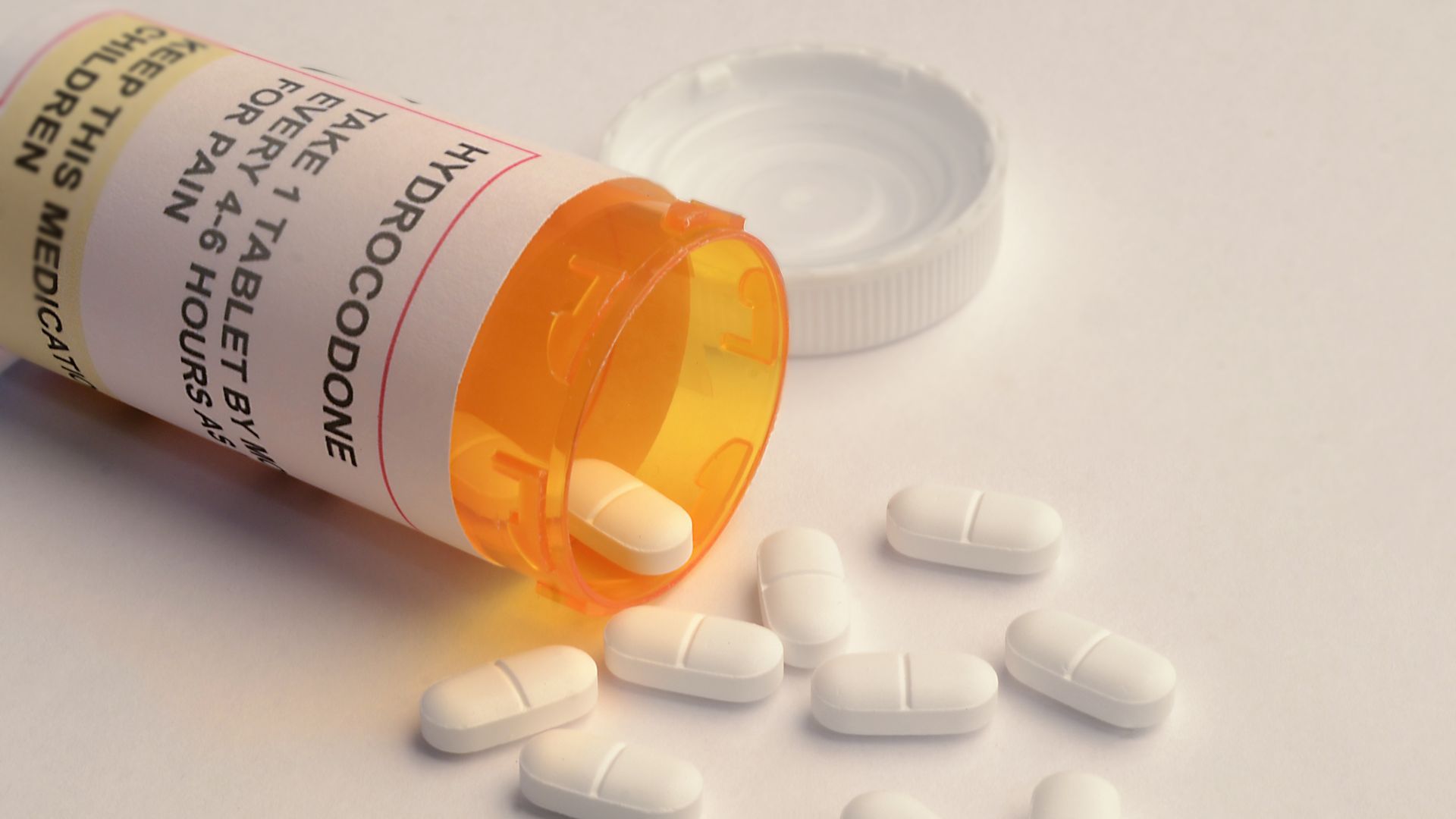 opened prescription bottle, labelled as containing the opioid hydrocodone