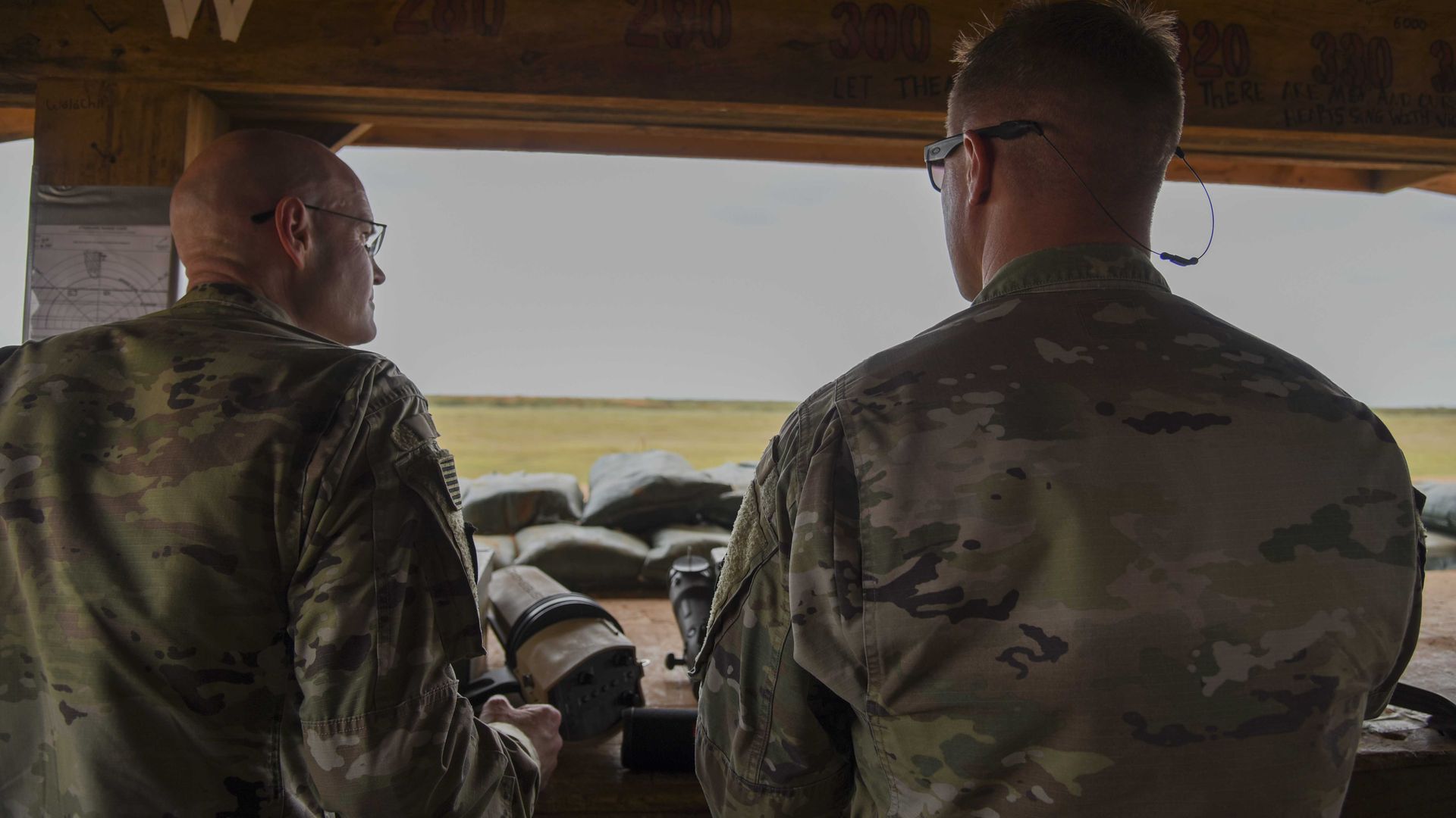 U.S. Army Brig. Gen. Damian T. Donahue and U.S. Army Maj. Chris Wendt look out from a tower in Somalia. Photo: Kristin Savage/U.S. Air Force