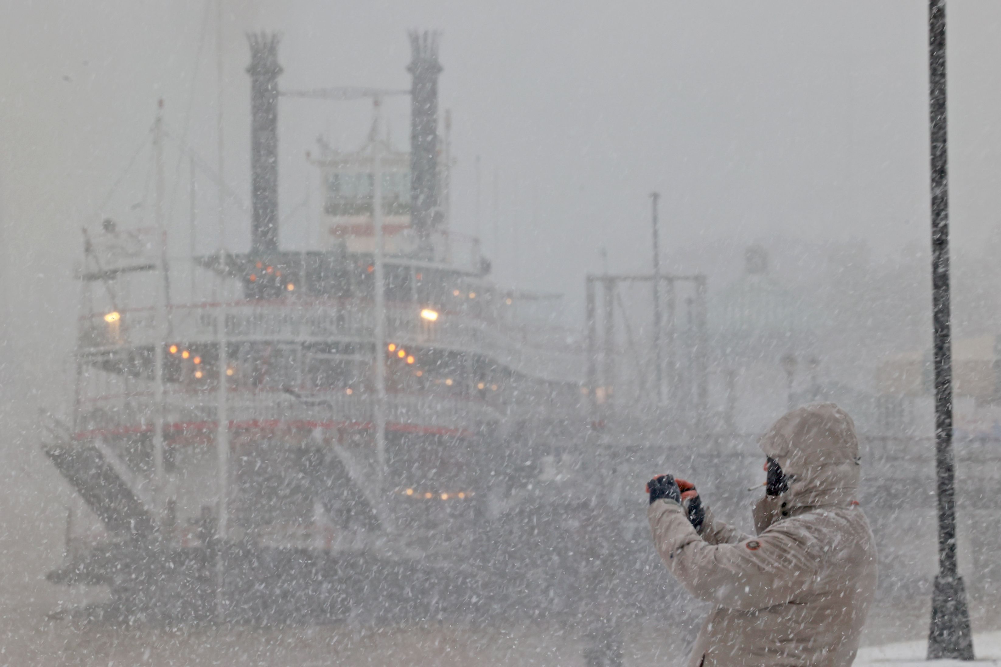 Photo shows a Mississippi riverboat during a snowstorm.