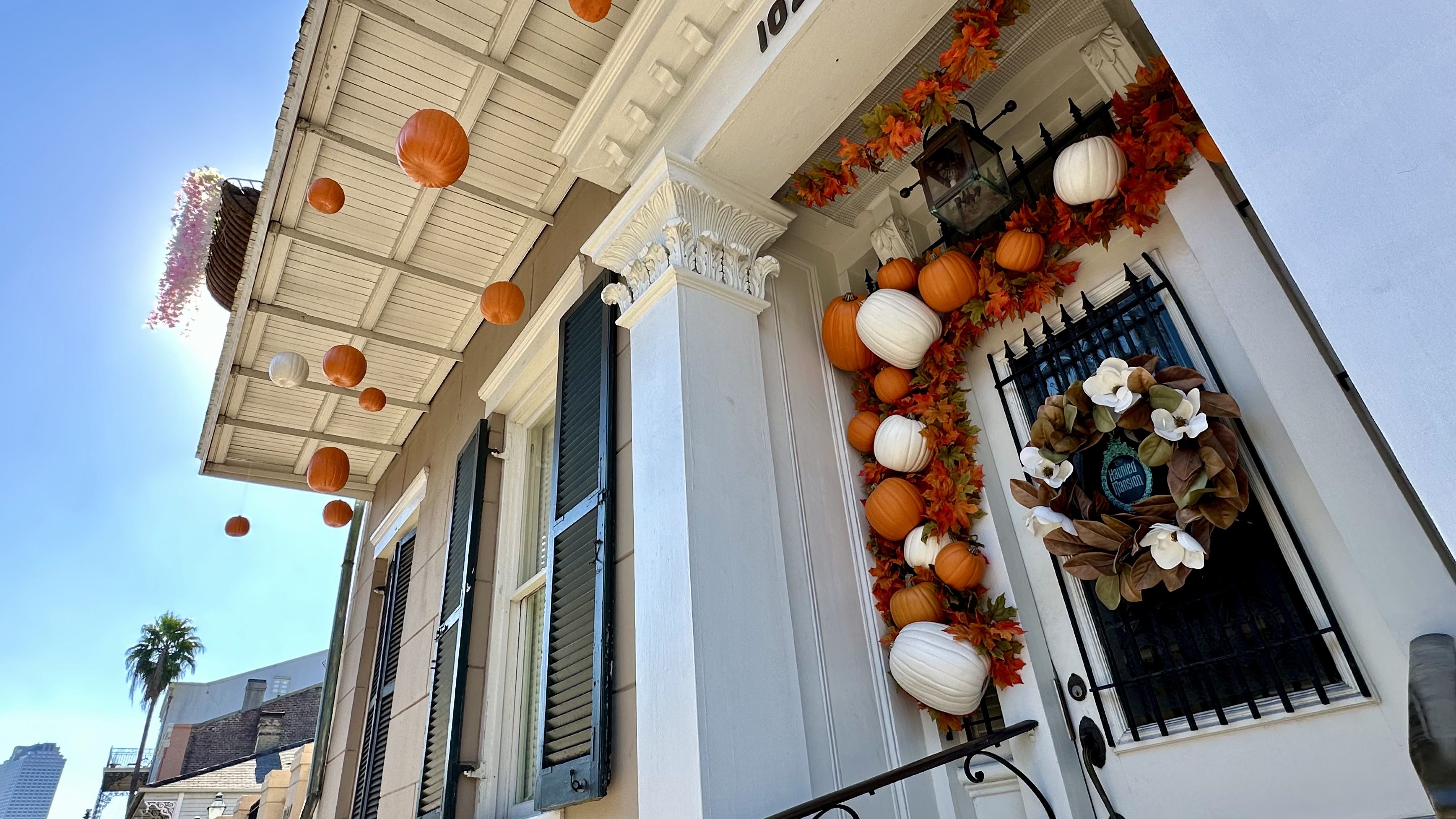 Image shows pumpkins on a house.