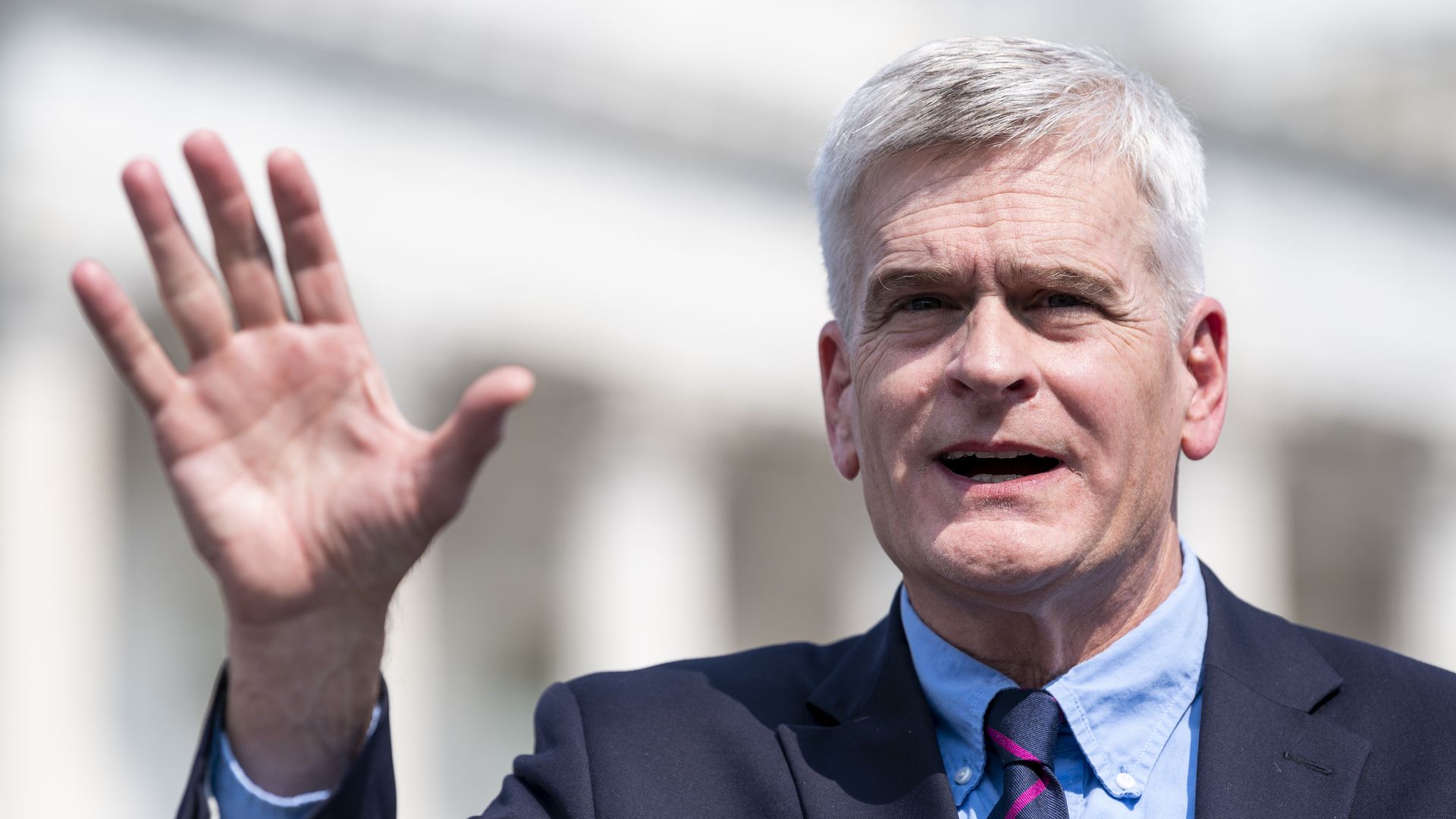 Bill Cassidy talks to reporters